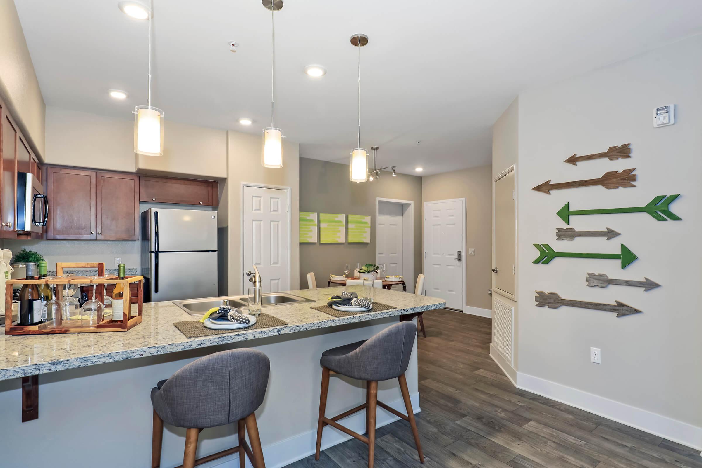 a kitchen with an island in the middle of a room