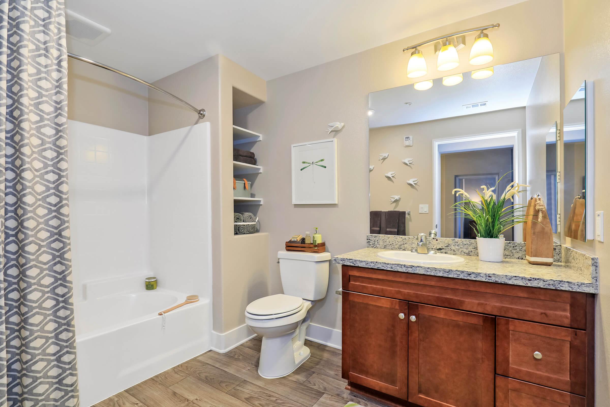 a kitchen with a sink and a mirror