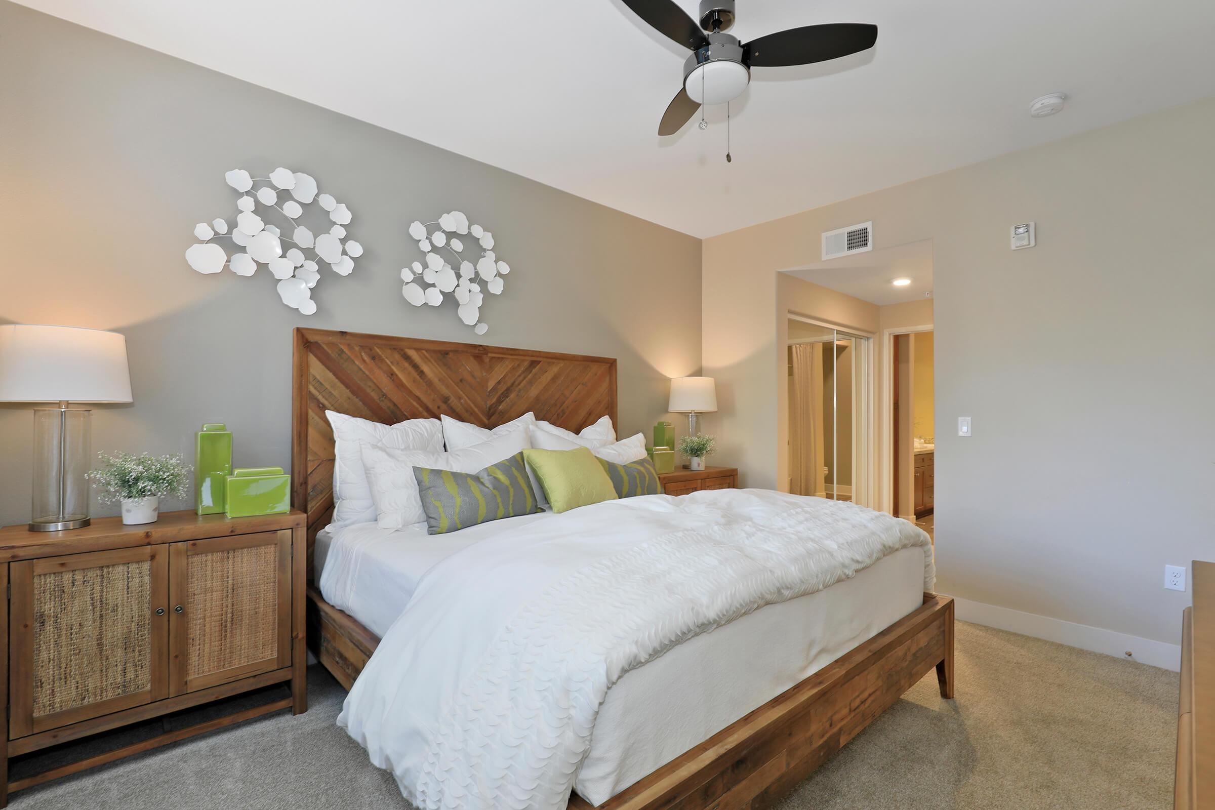 a bedroom with a large bed in a hotel room