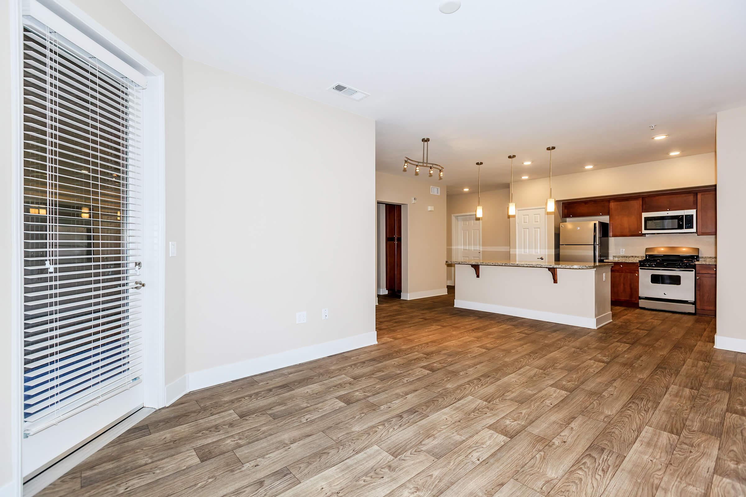 a room filled with furniture and a large window