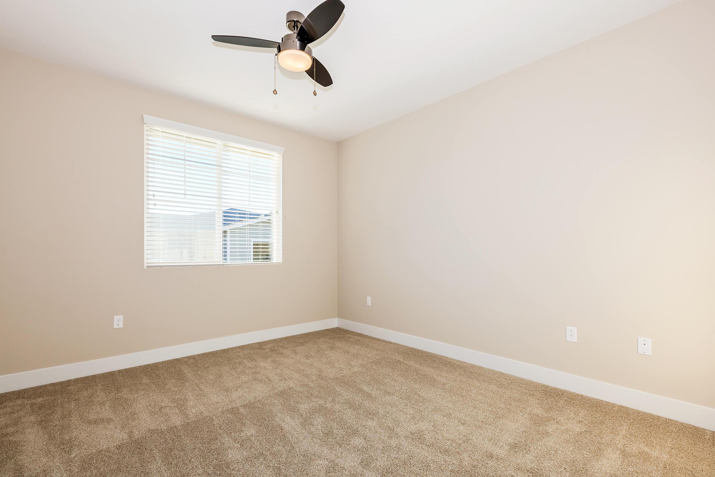 a bedroom with a large window