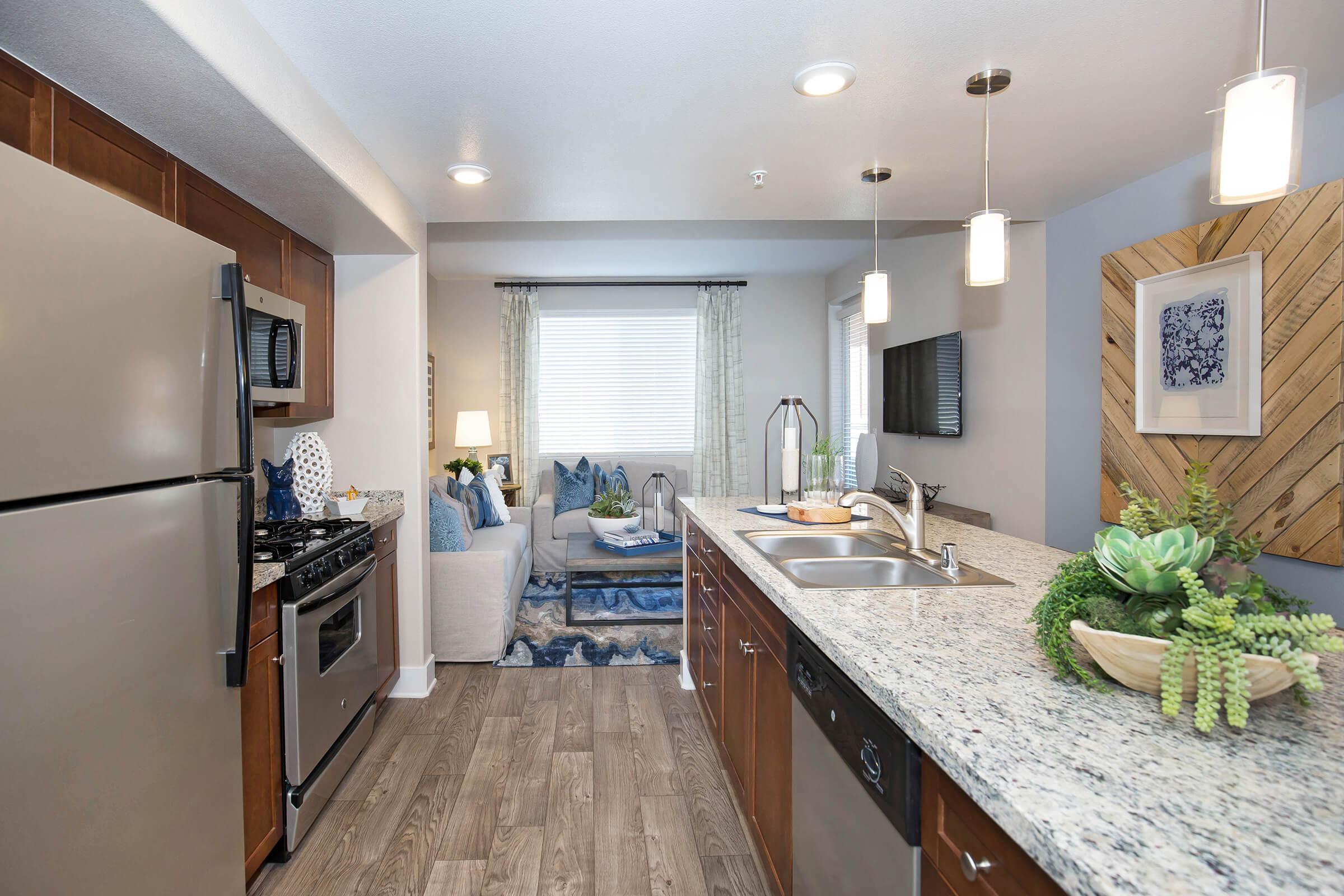 a kitchen with an island in the middle of a room