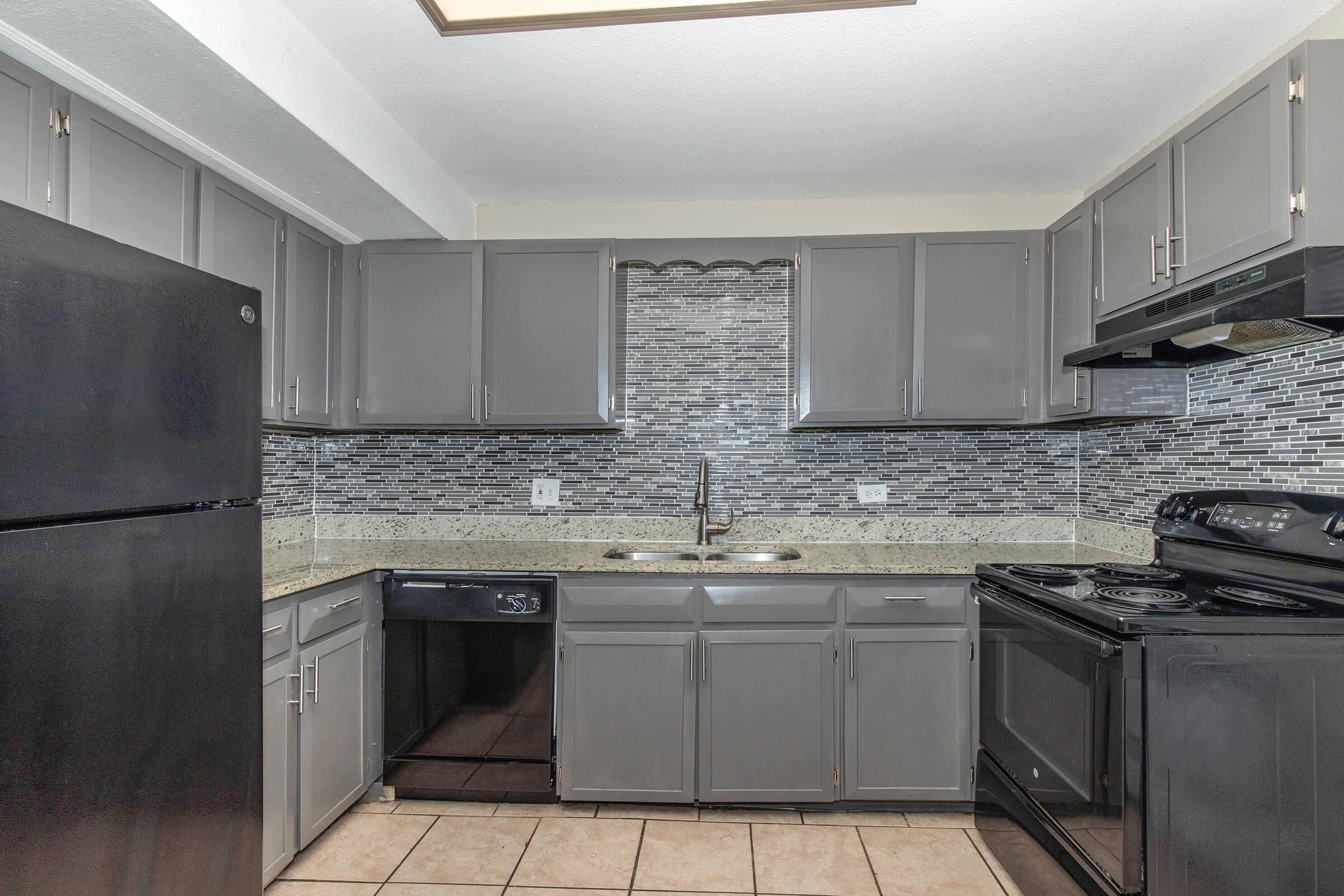 a large kitchen with stainless steel appliances