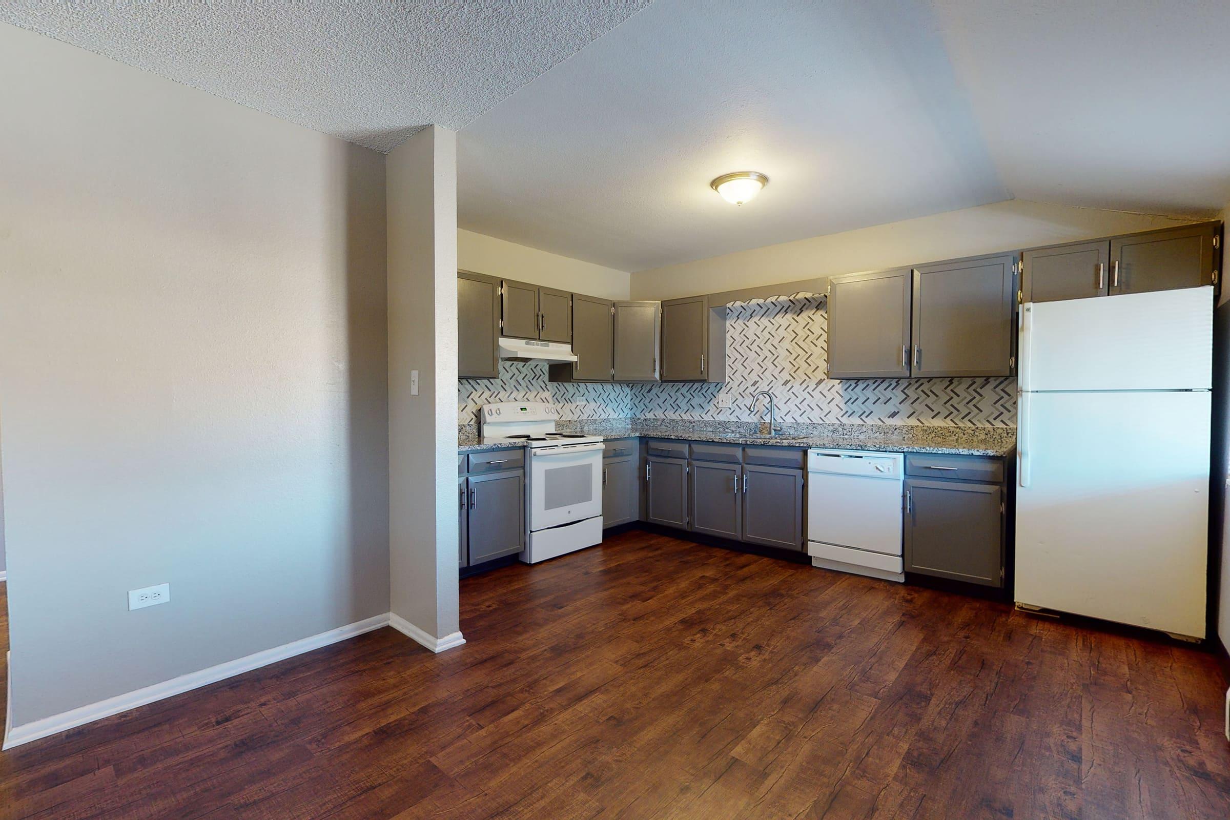 a kitchen with a wood floor