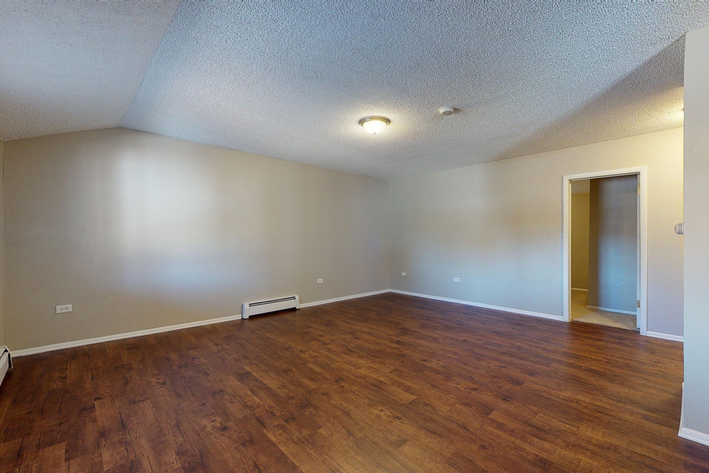 a kitchen with a wood floor