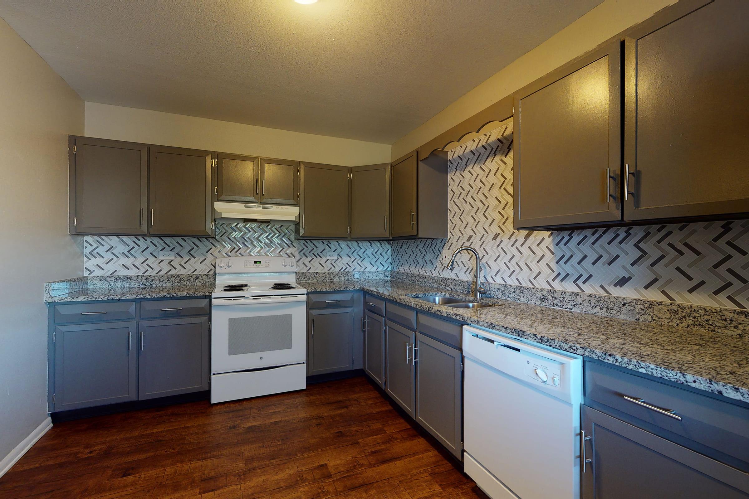 a large kitchen with stainless steel appliances