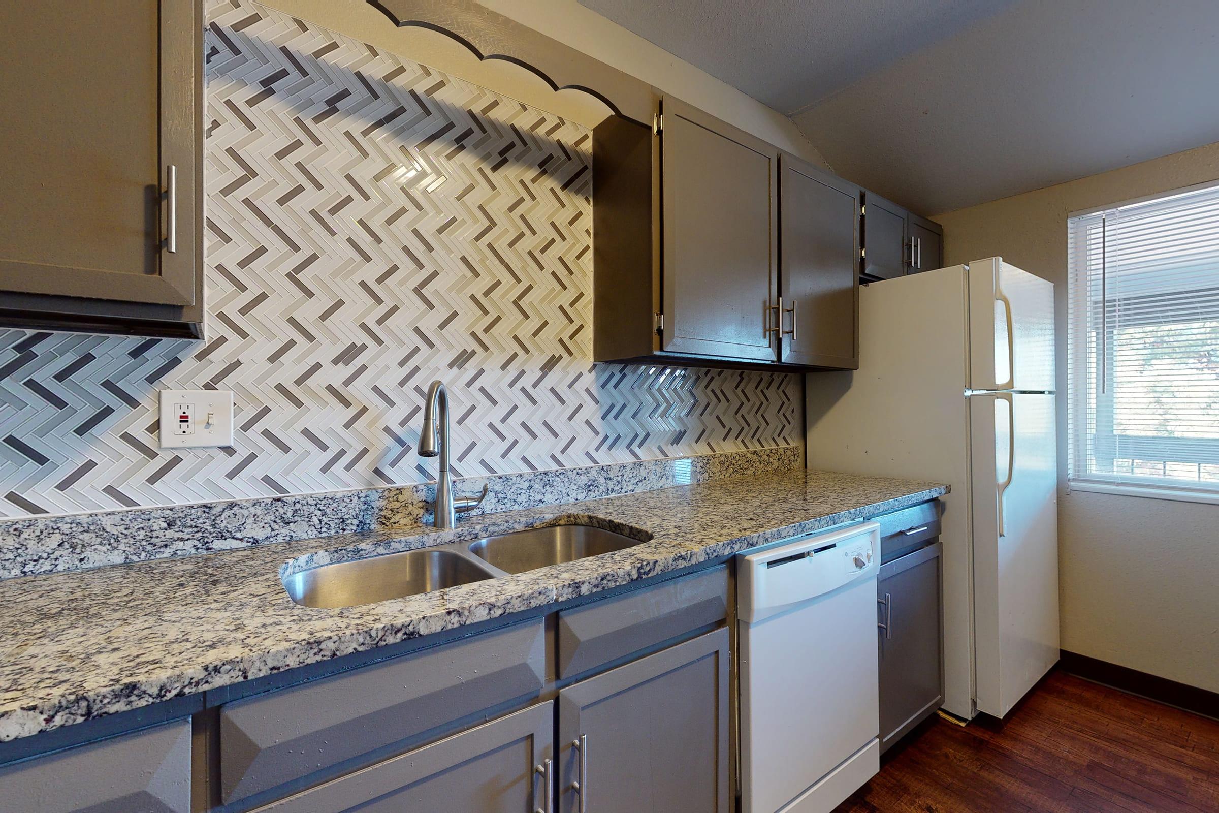 a kitchen with a sink and a window