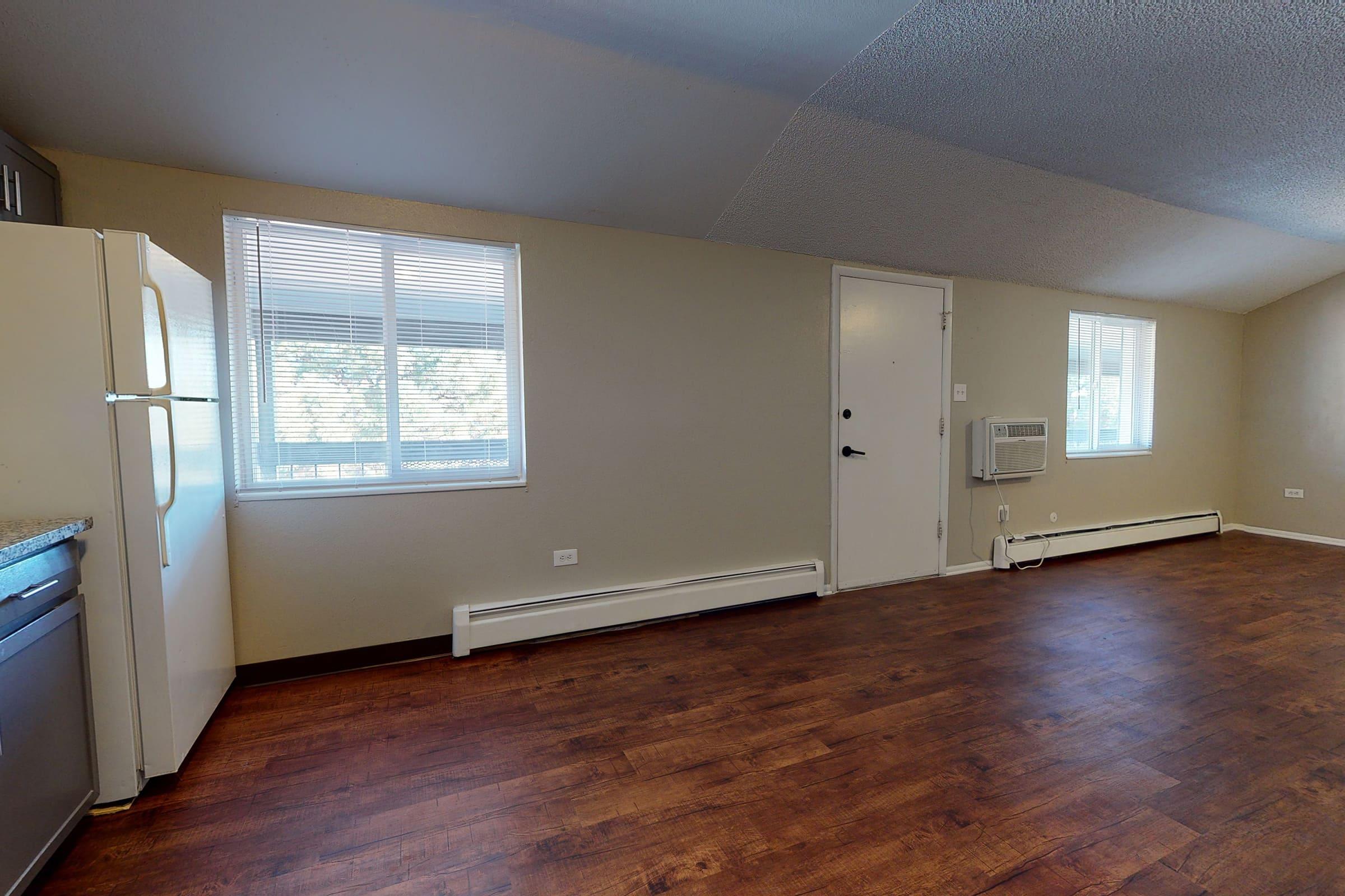 a large empty room with a wooden floor