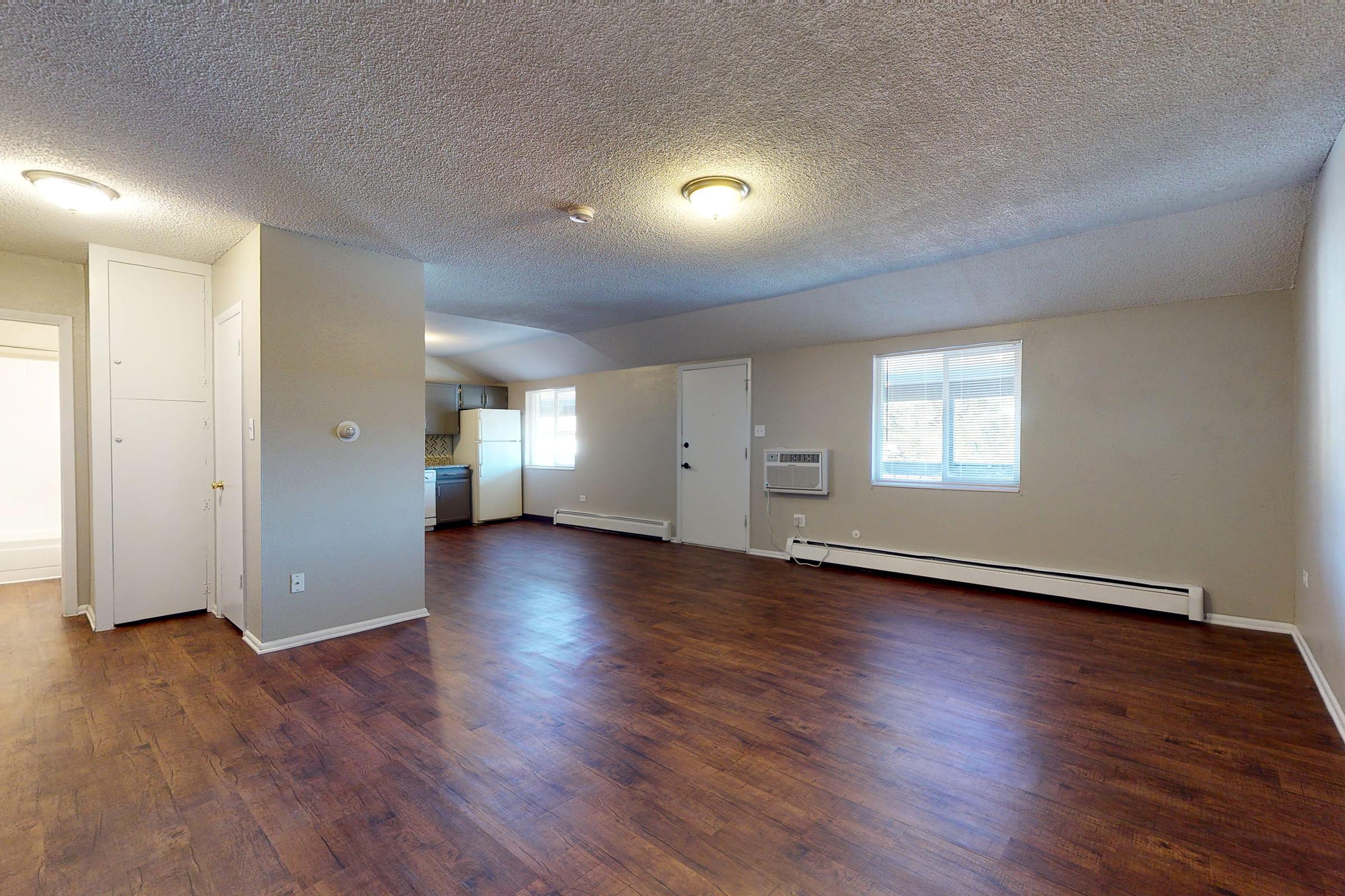 a large room with a hard wood floor