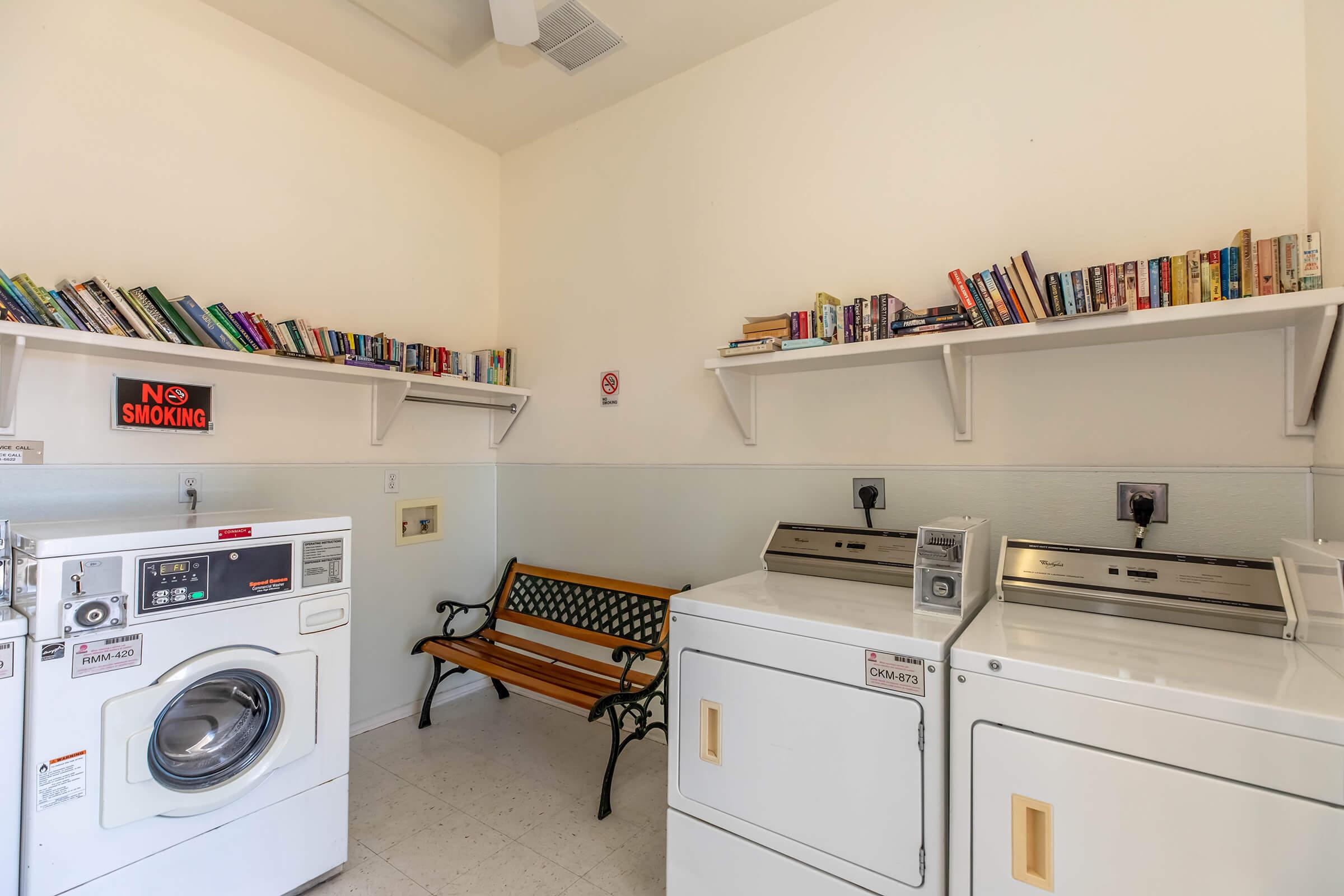 a kitchen with a stove top oven sitting inside of a room