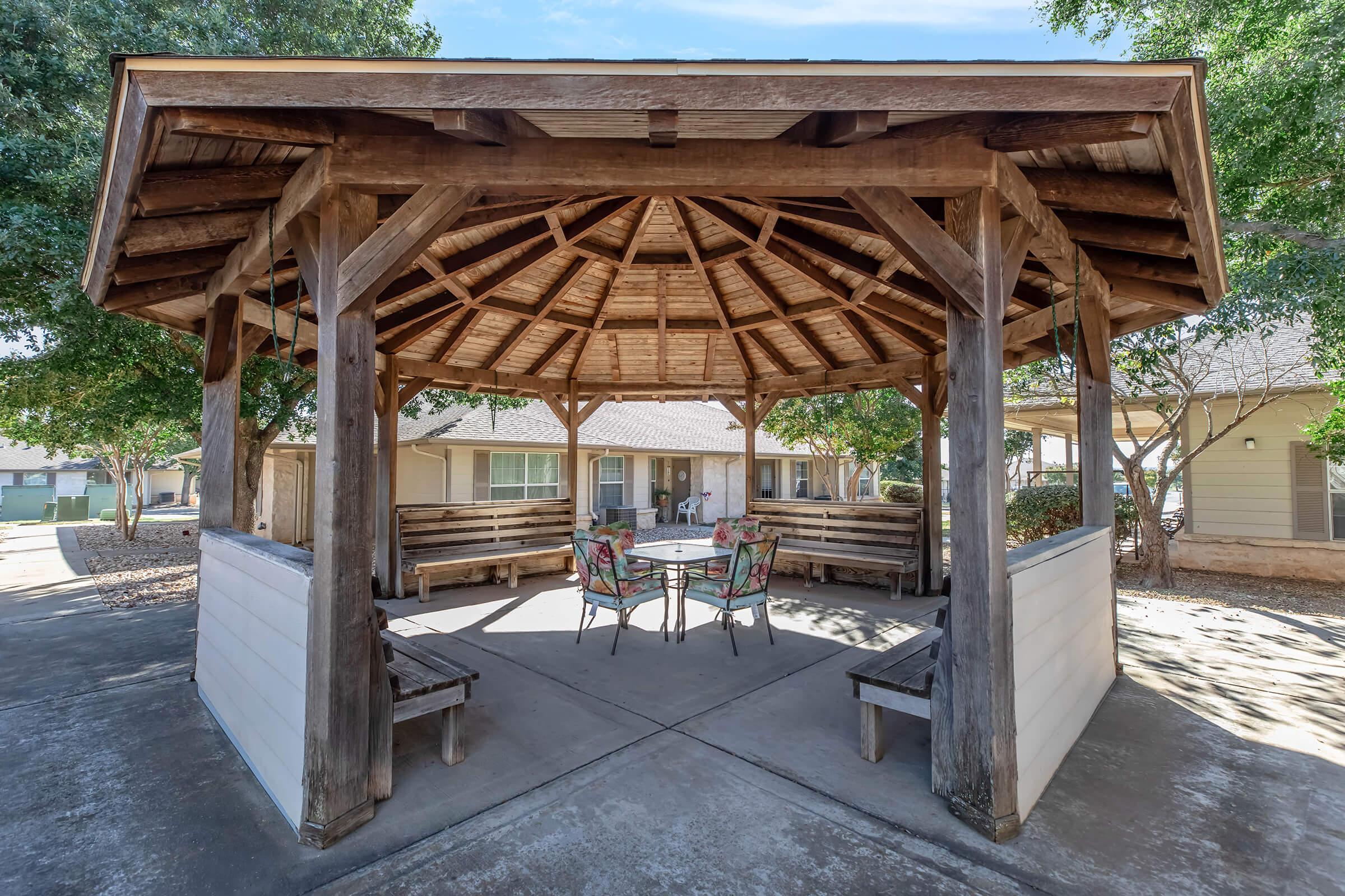 a wooden bench in front of a house