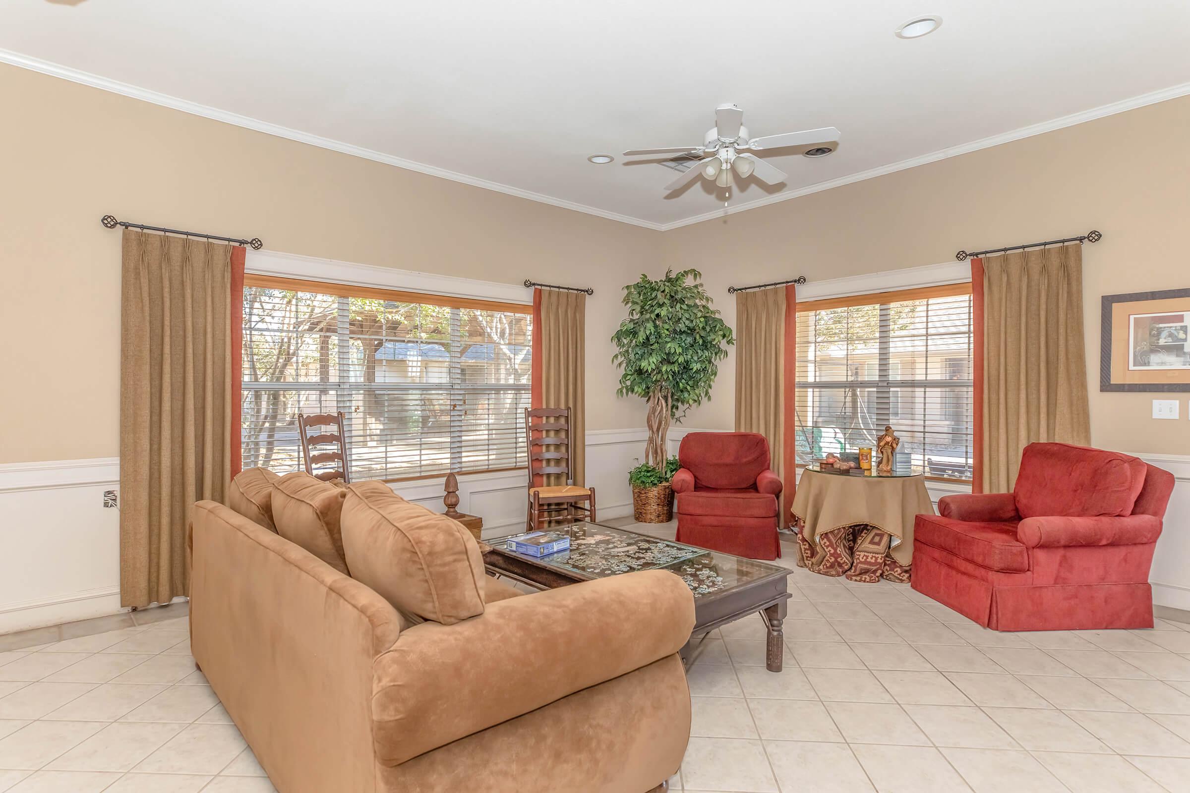 a living room filled with furniture and a fire place