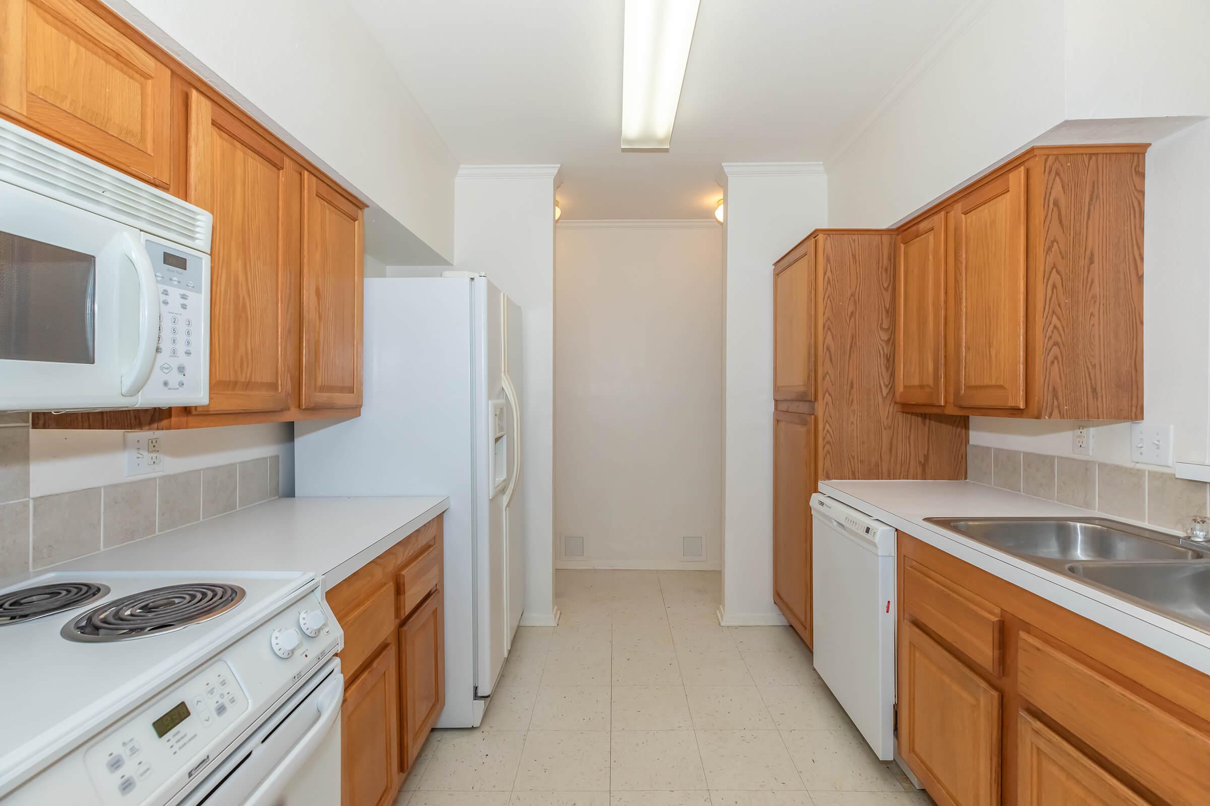 a kitchen with a sink and a microwave