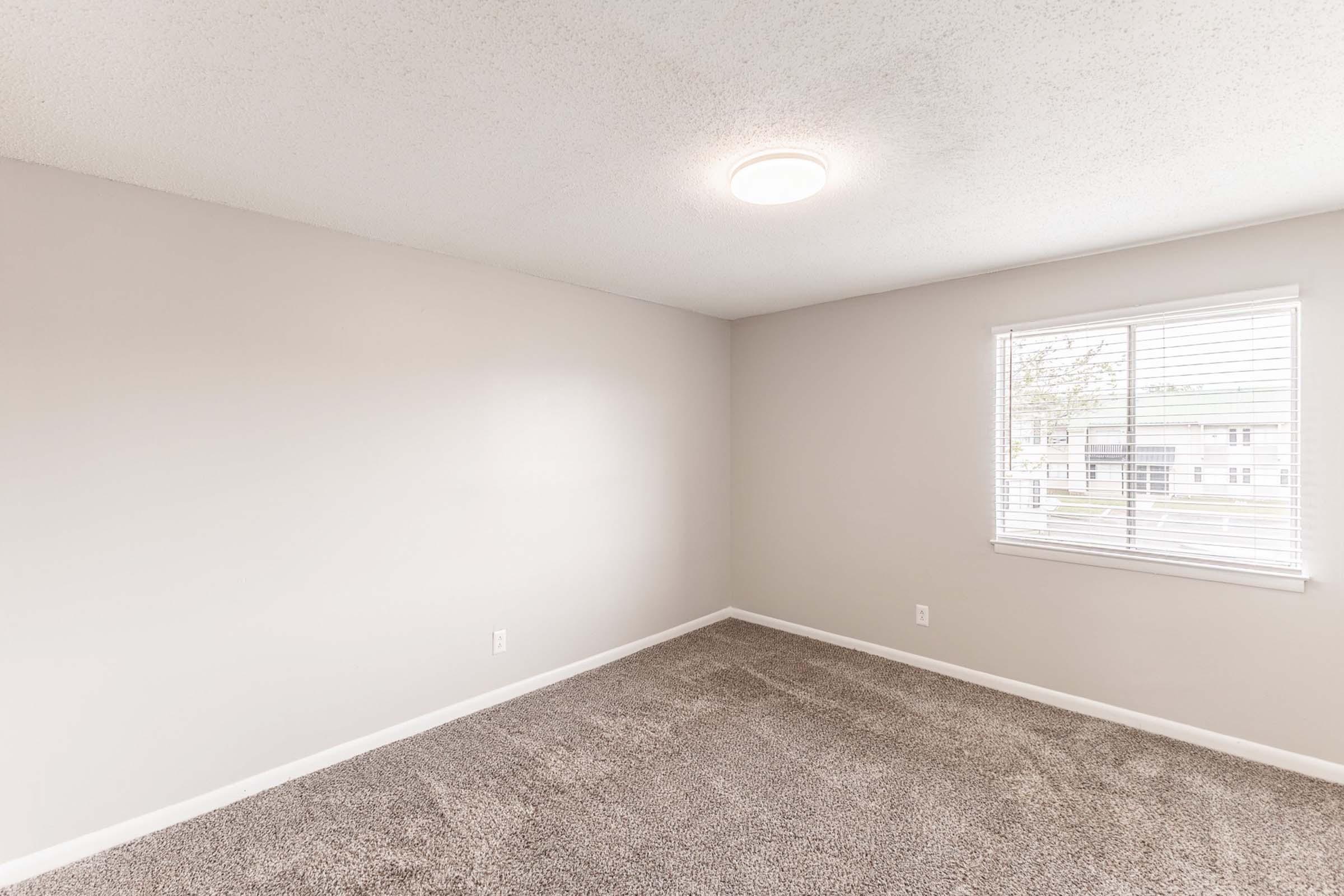 a bedroom with a large window