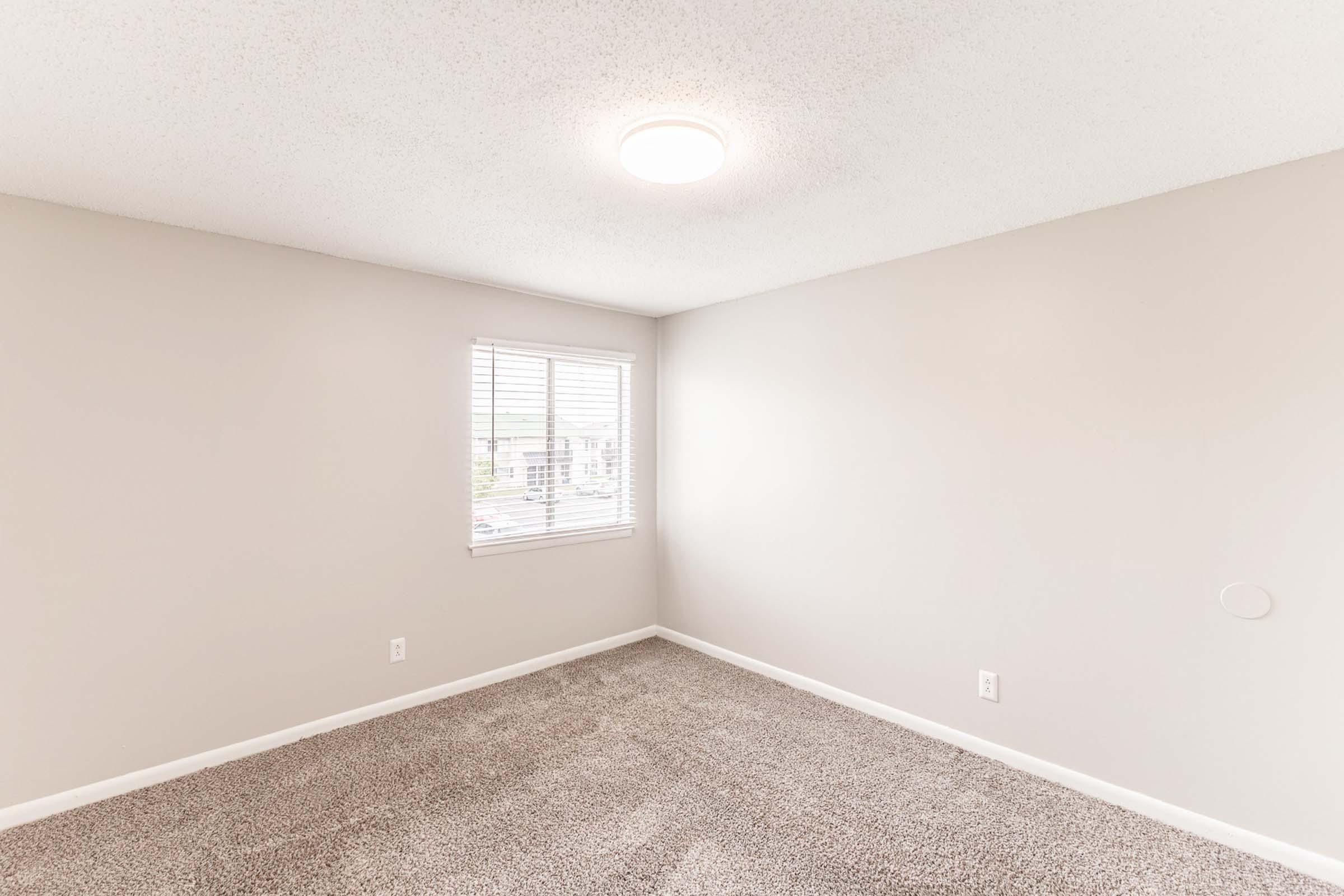 a bedroom with a large mirror