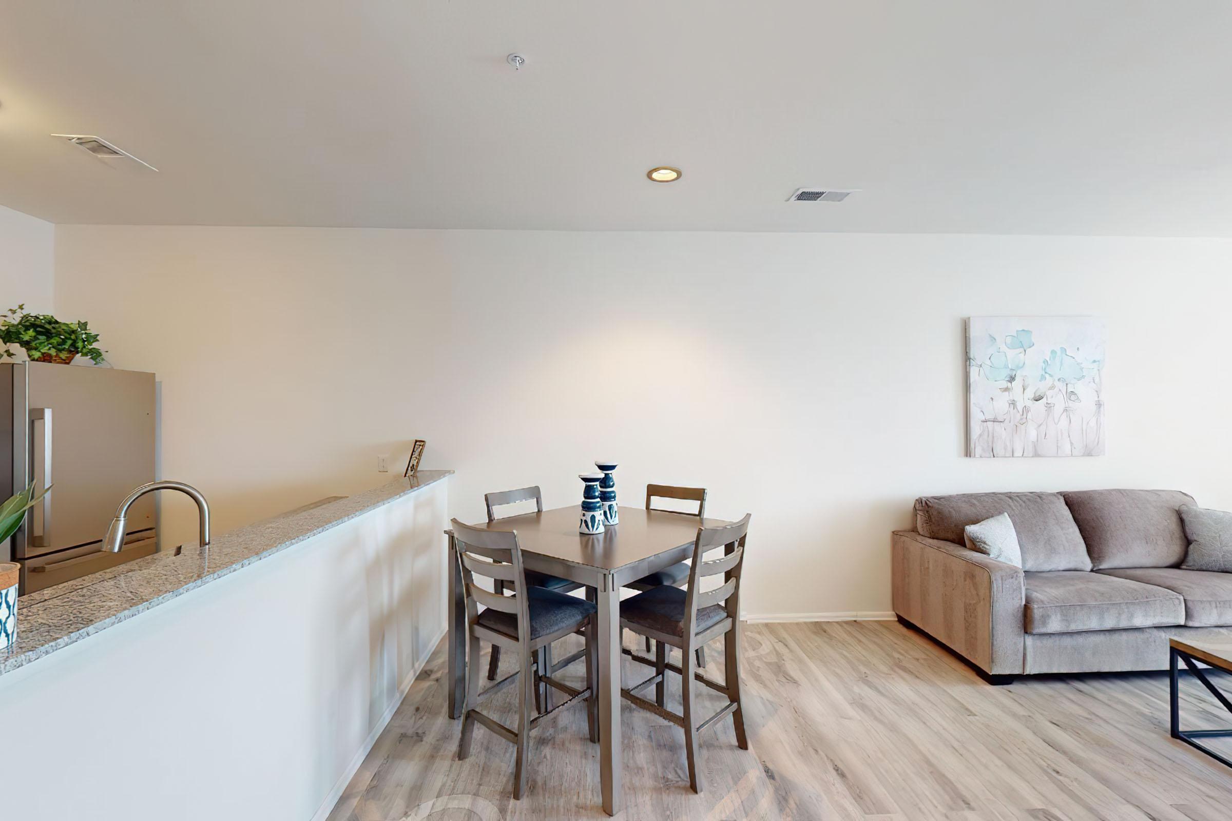 a living room filled with furniture and a table