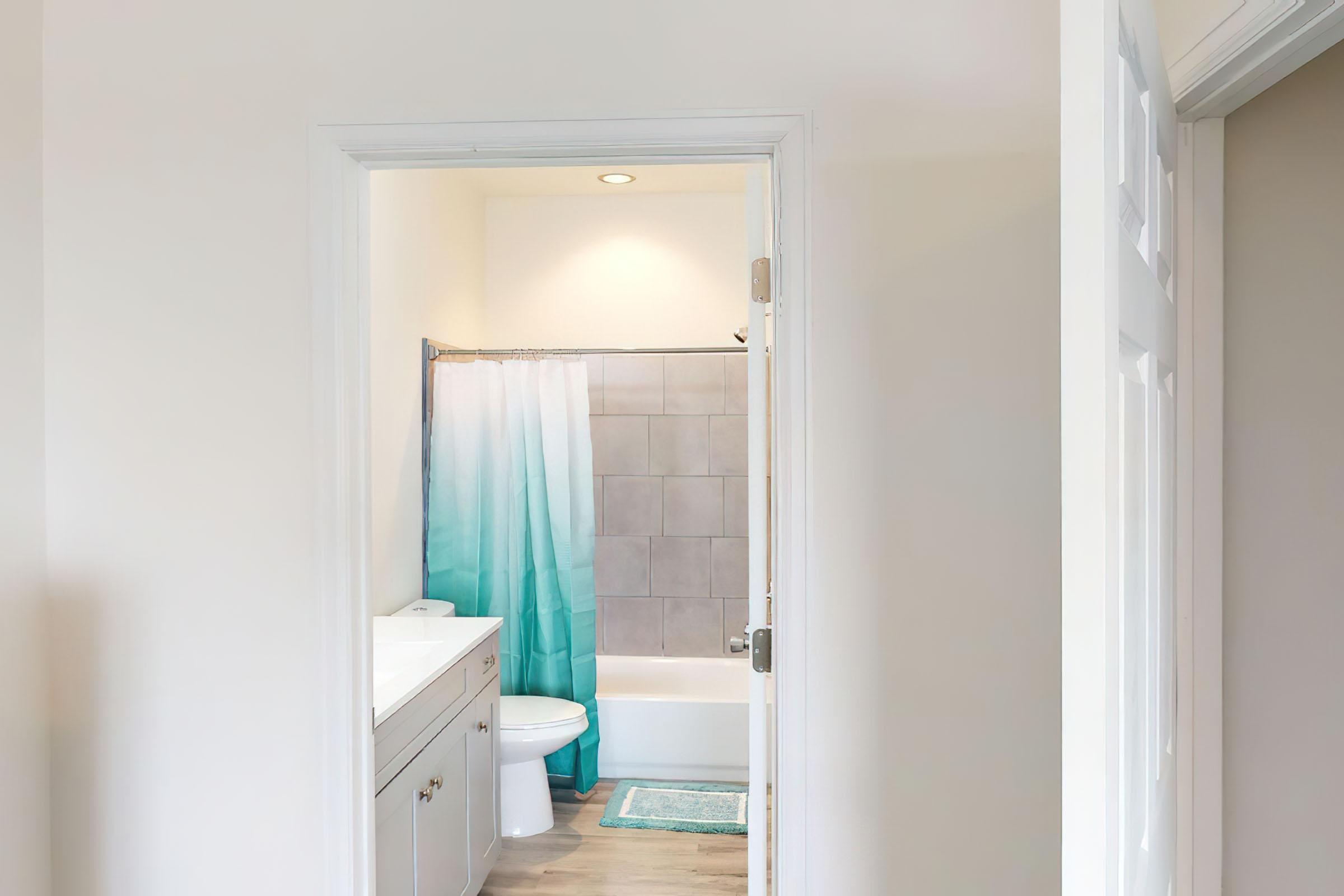 a view of a shower in a small room