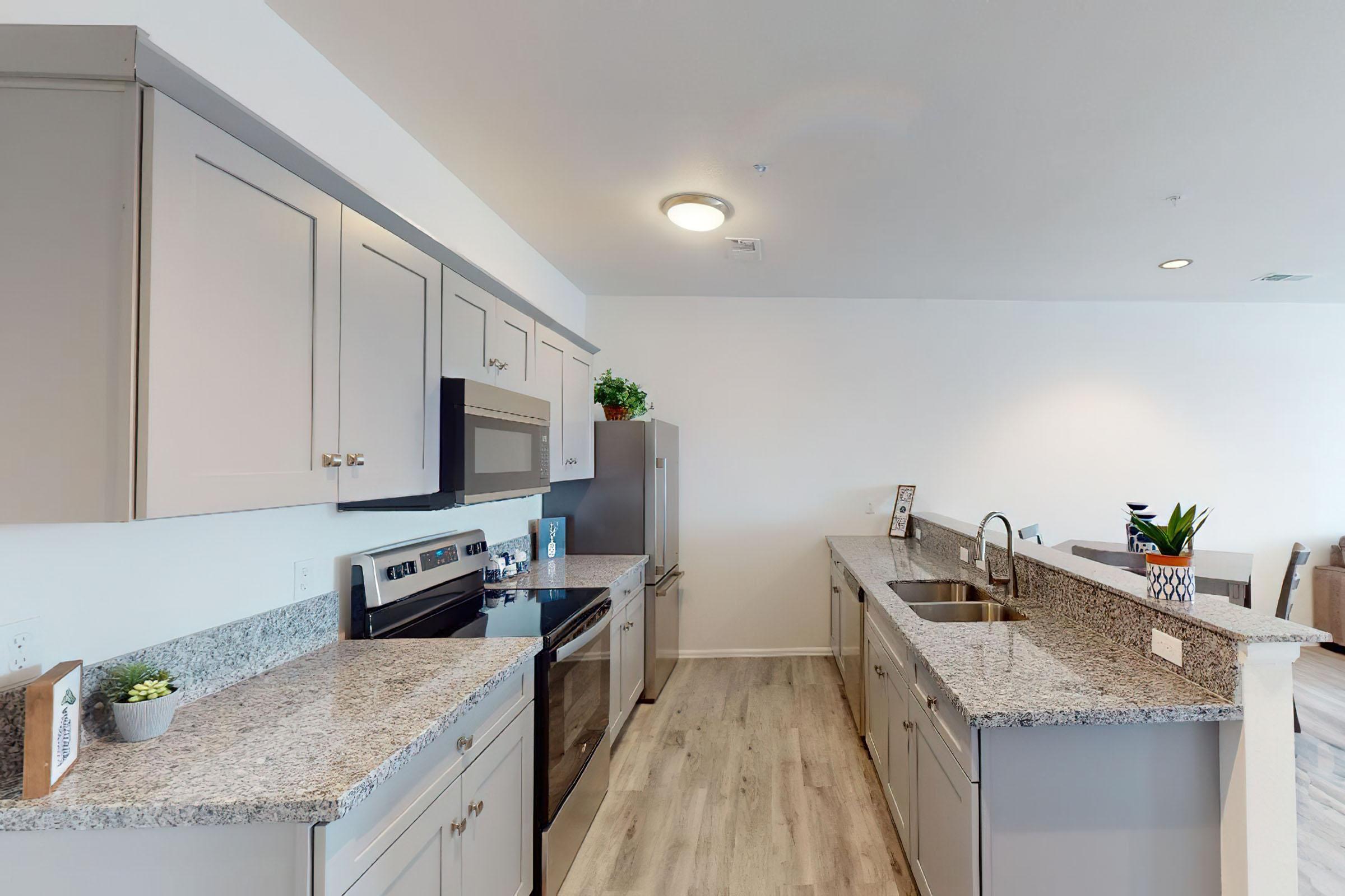 a large kitchen with stainless steel appliances