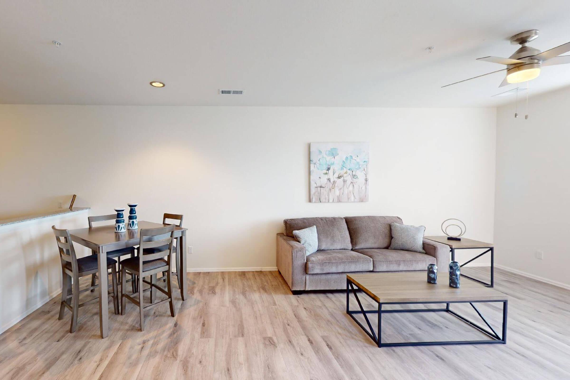 a living room with hard wood floors