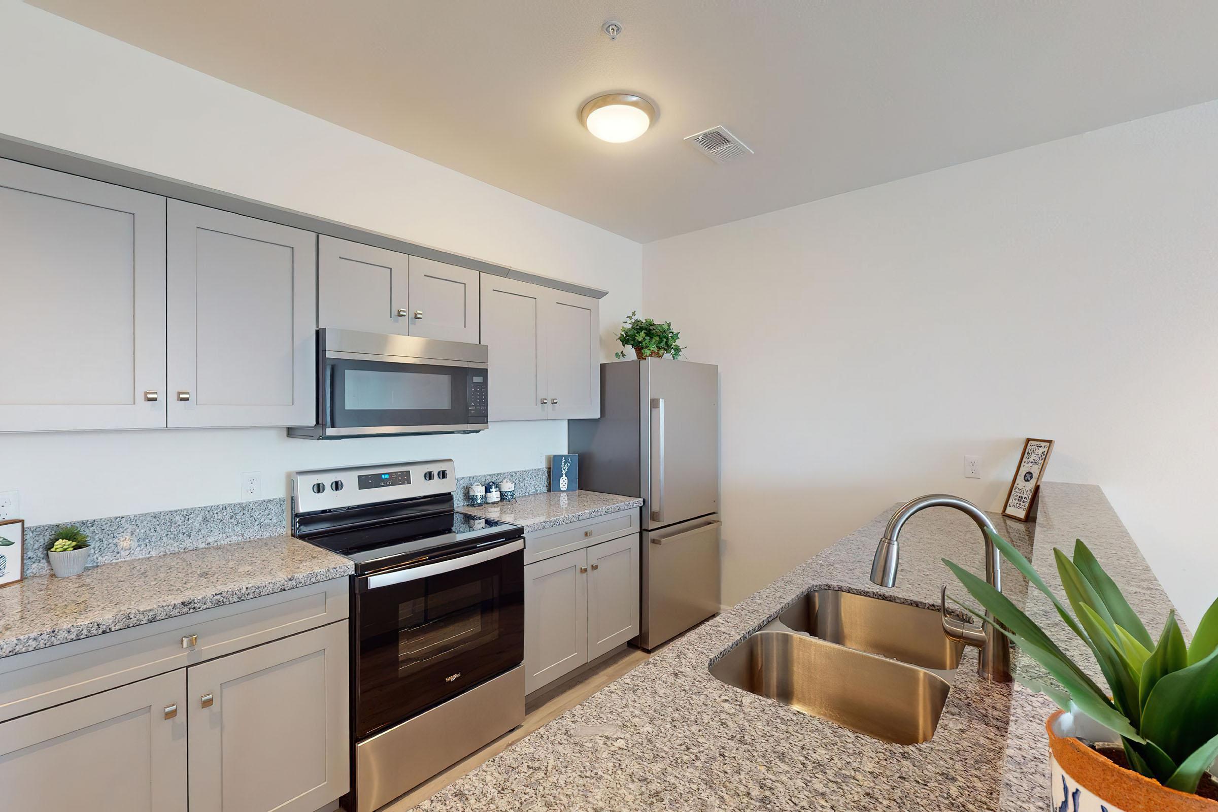 a modern kitchen with stainless steel appliances