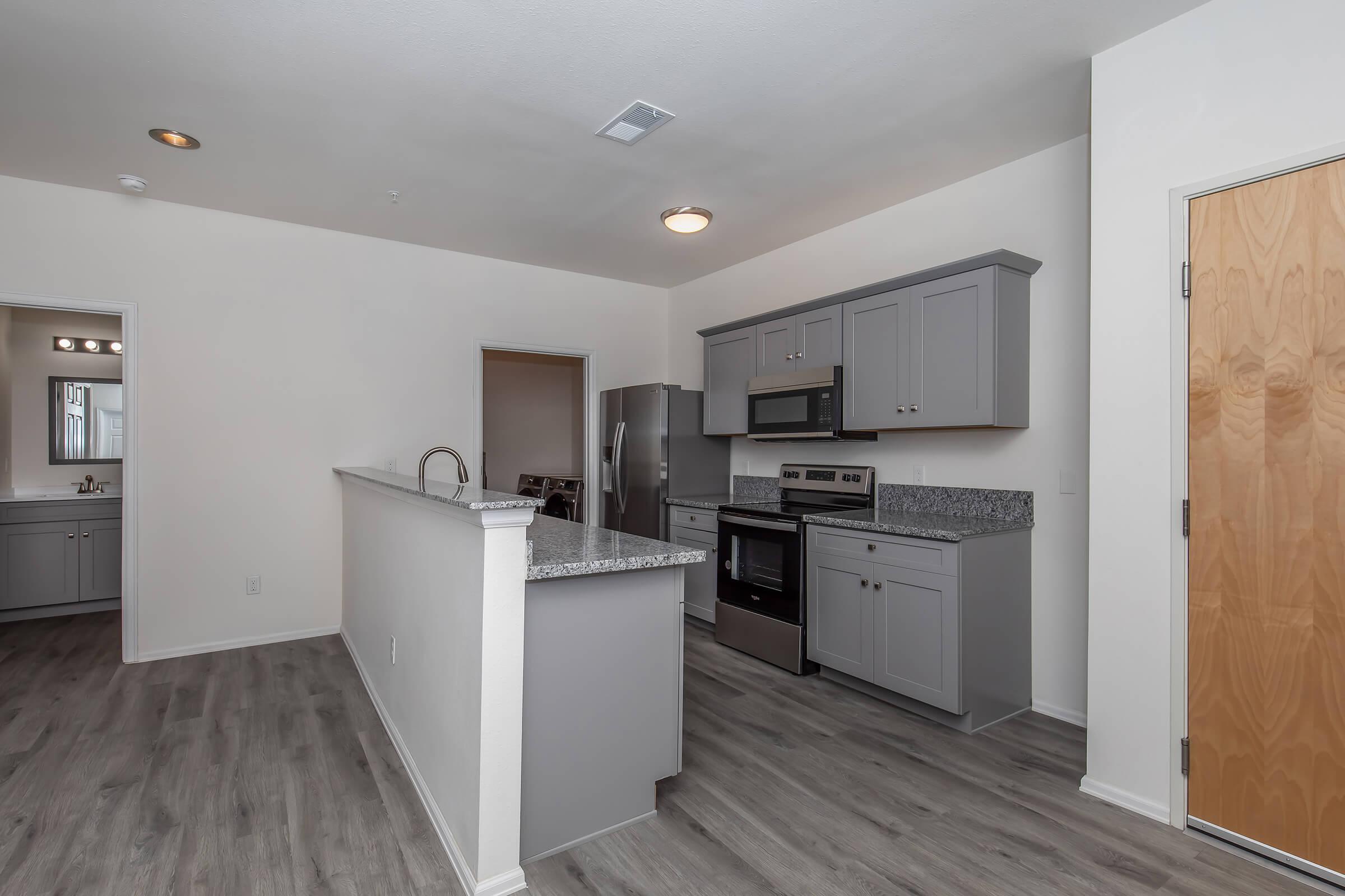 a kitchen with a wood floor