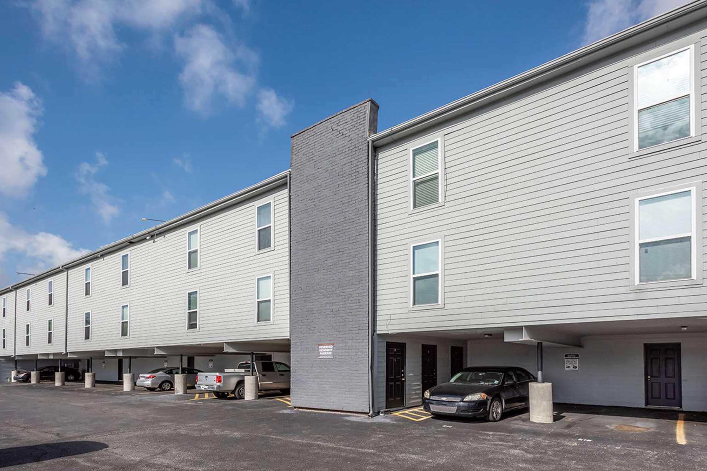 a large brick building with a parking lot