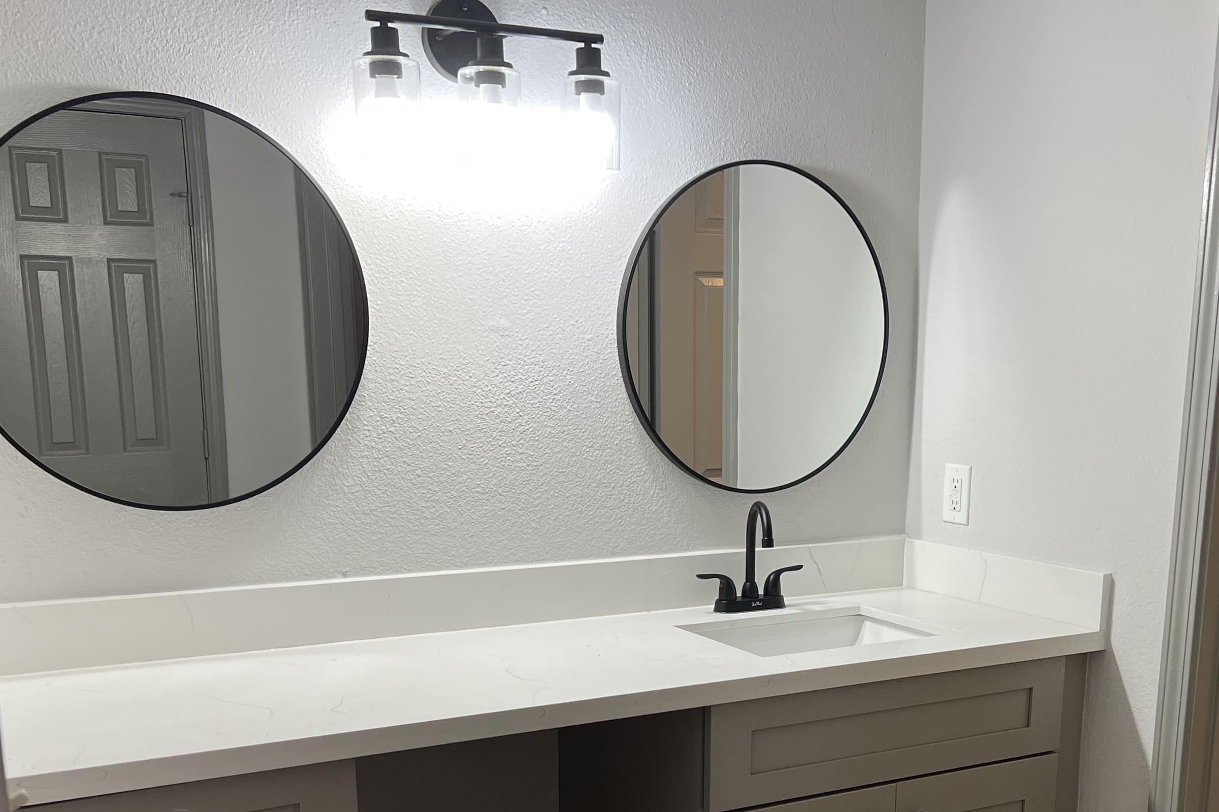 a close up of a sink and a mirror