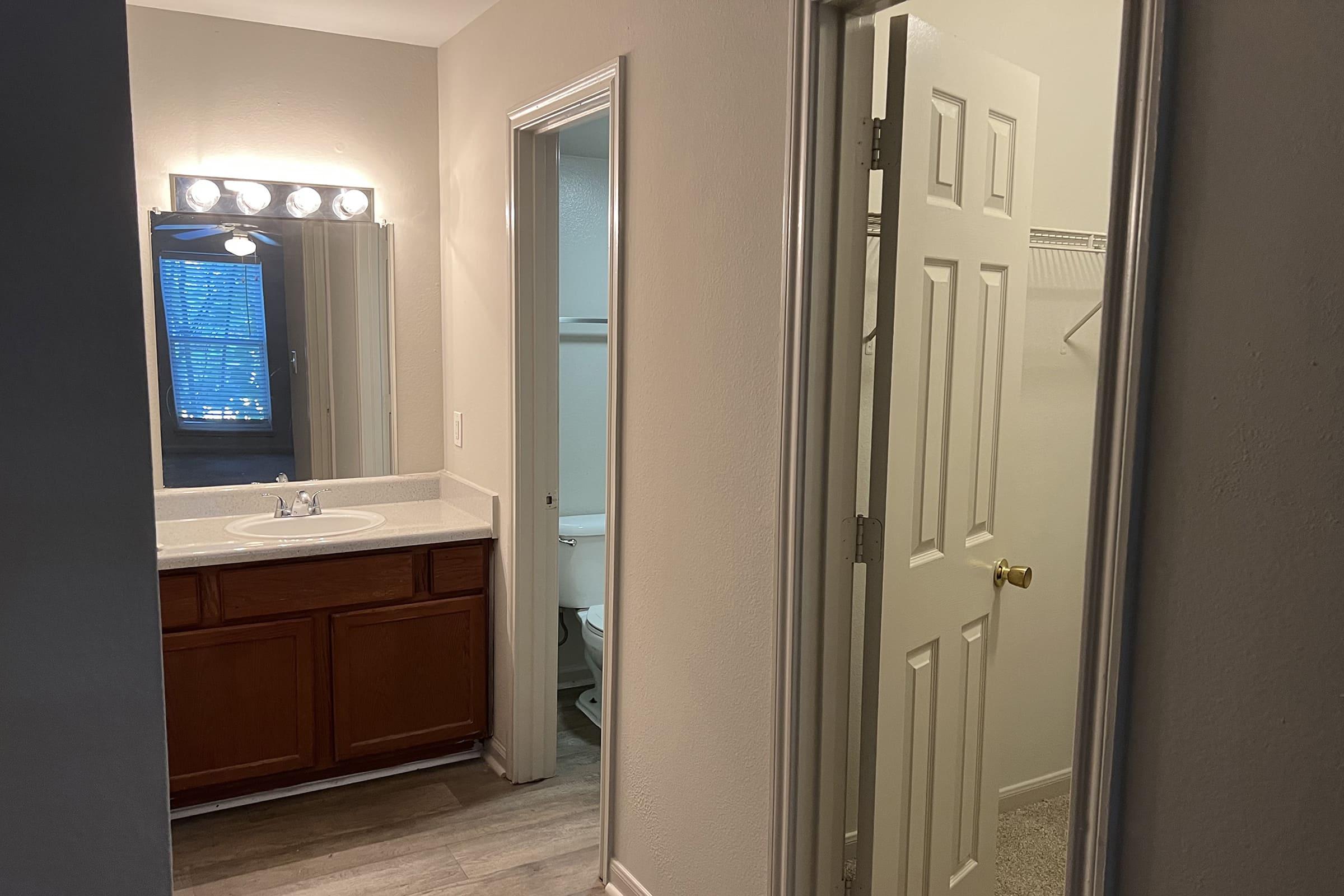 a double door refrigerator in the corner of a room