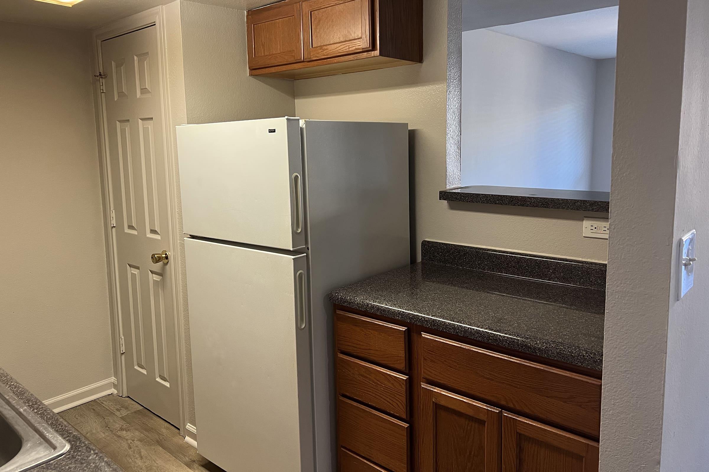 a stove top oven sitting inside of a refrigerator