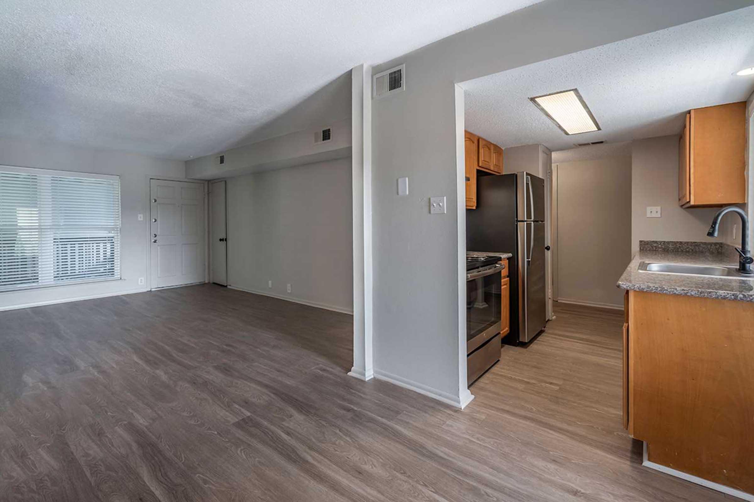 a kitchen with a wood floor