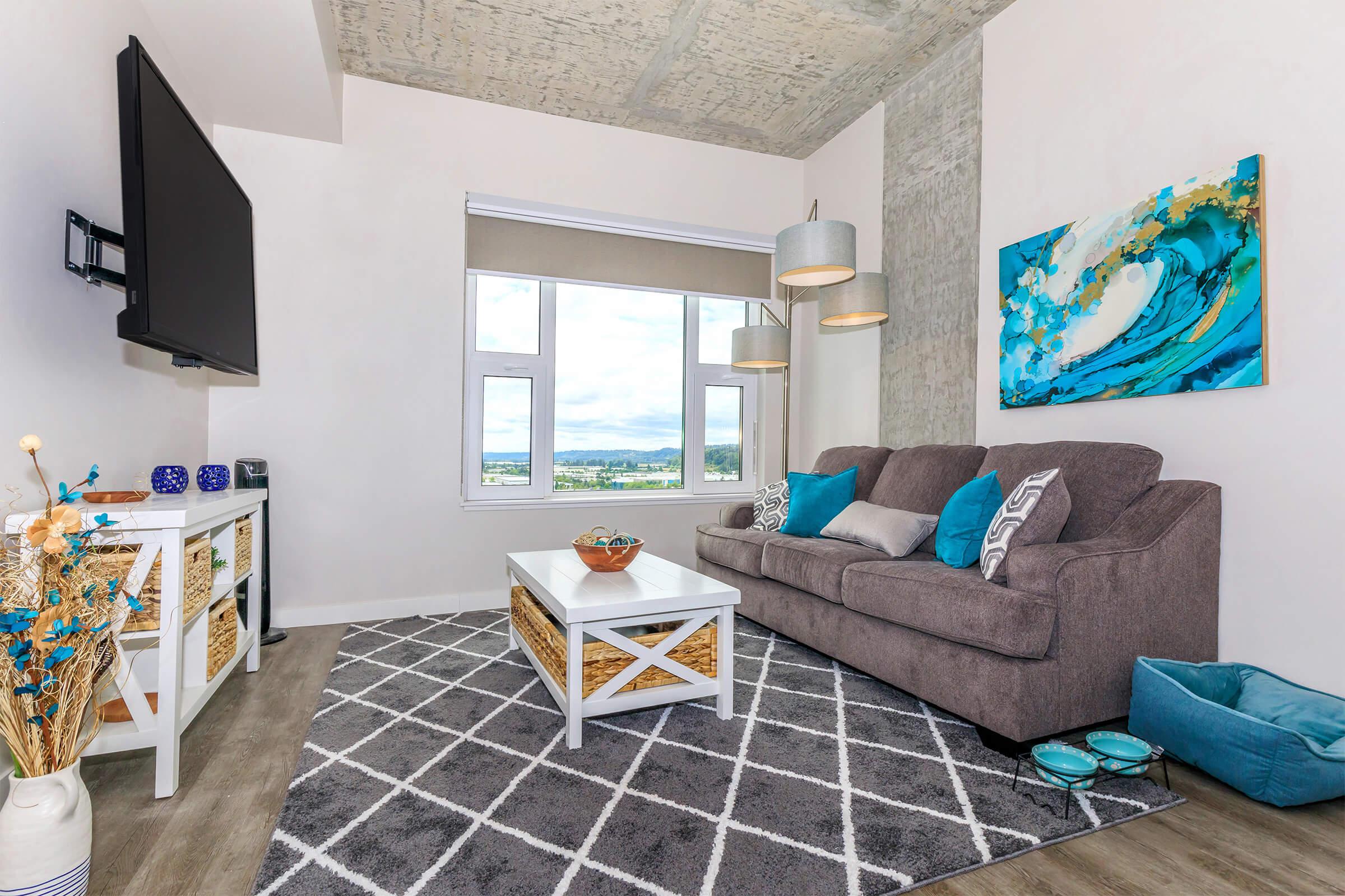 a bedroom with a view of a living room
