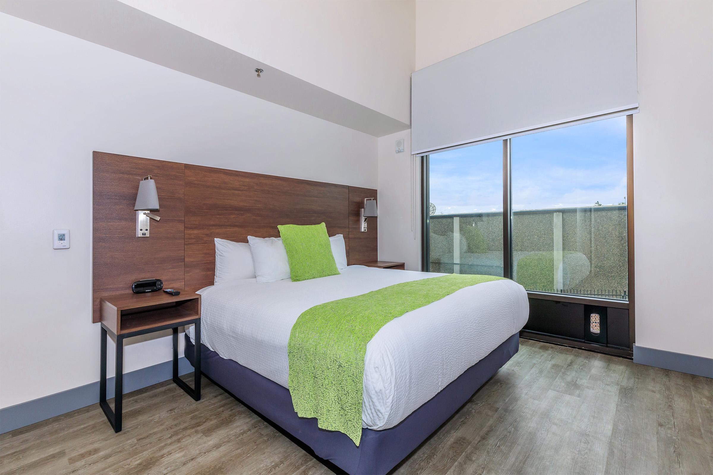 a bedroom with a large bed in a room