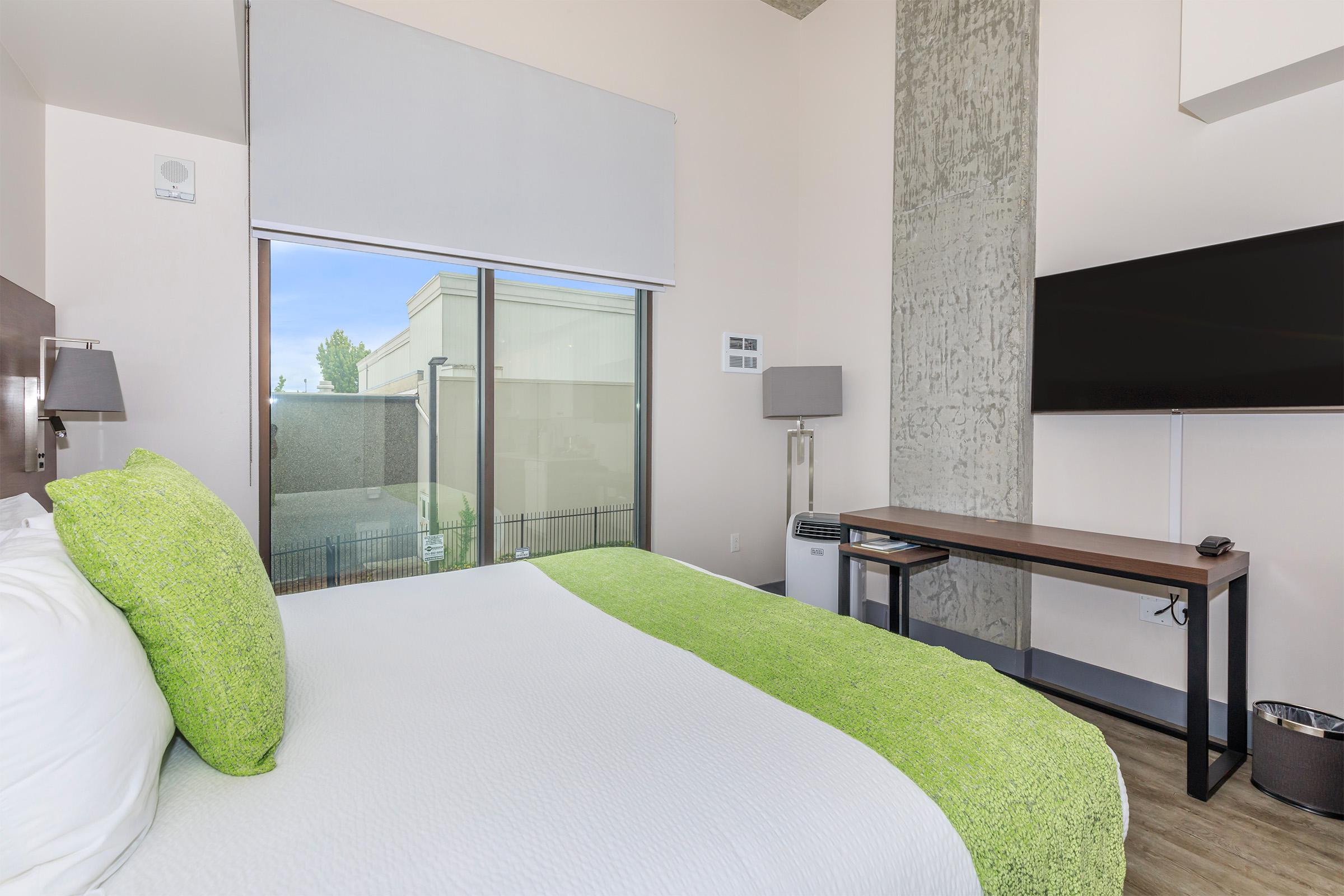a bedroom with a bed in a hotel room