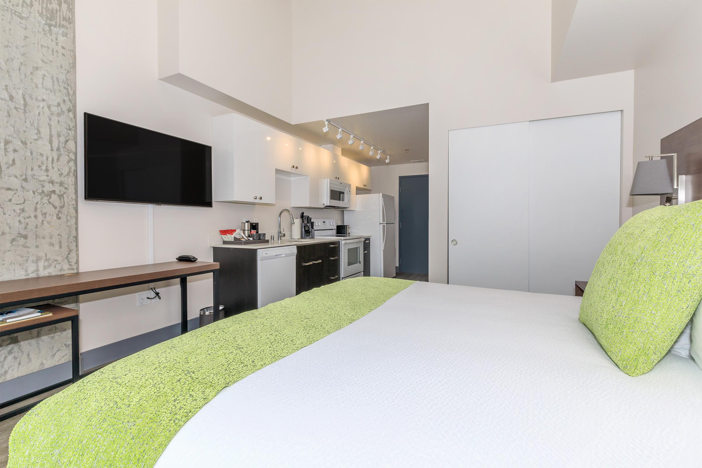 a bedroom with a bed in a room