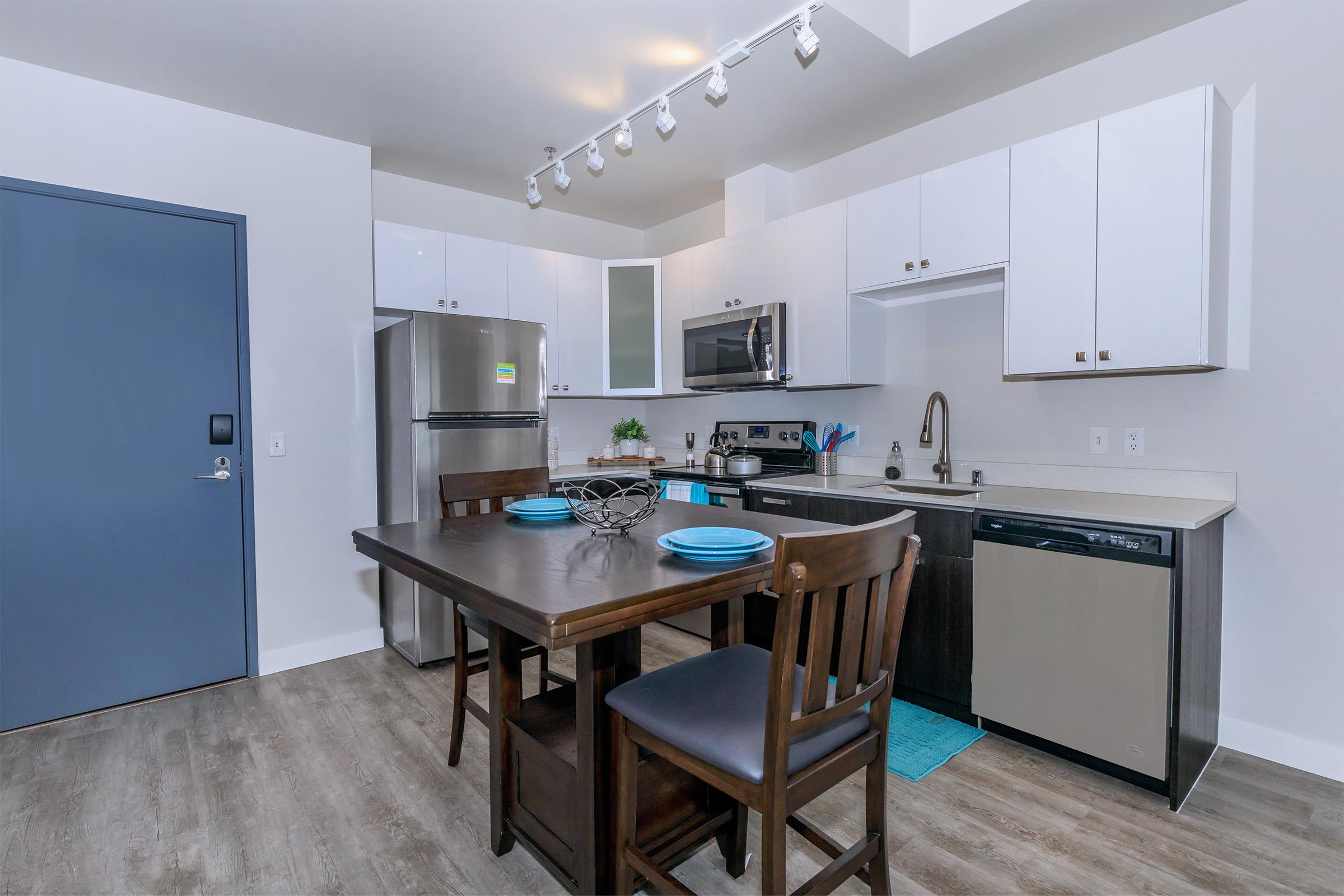 a kitchen with a dining room table