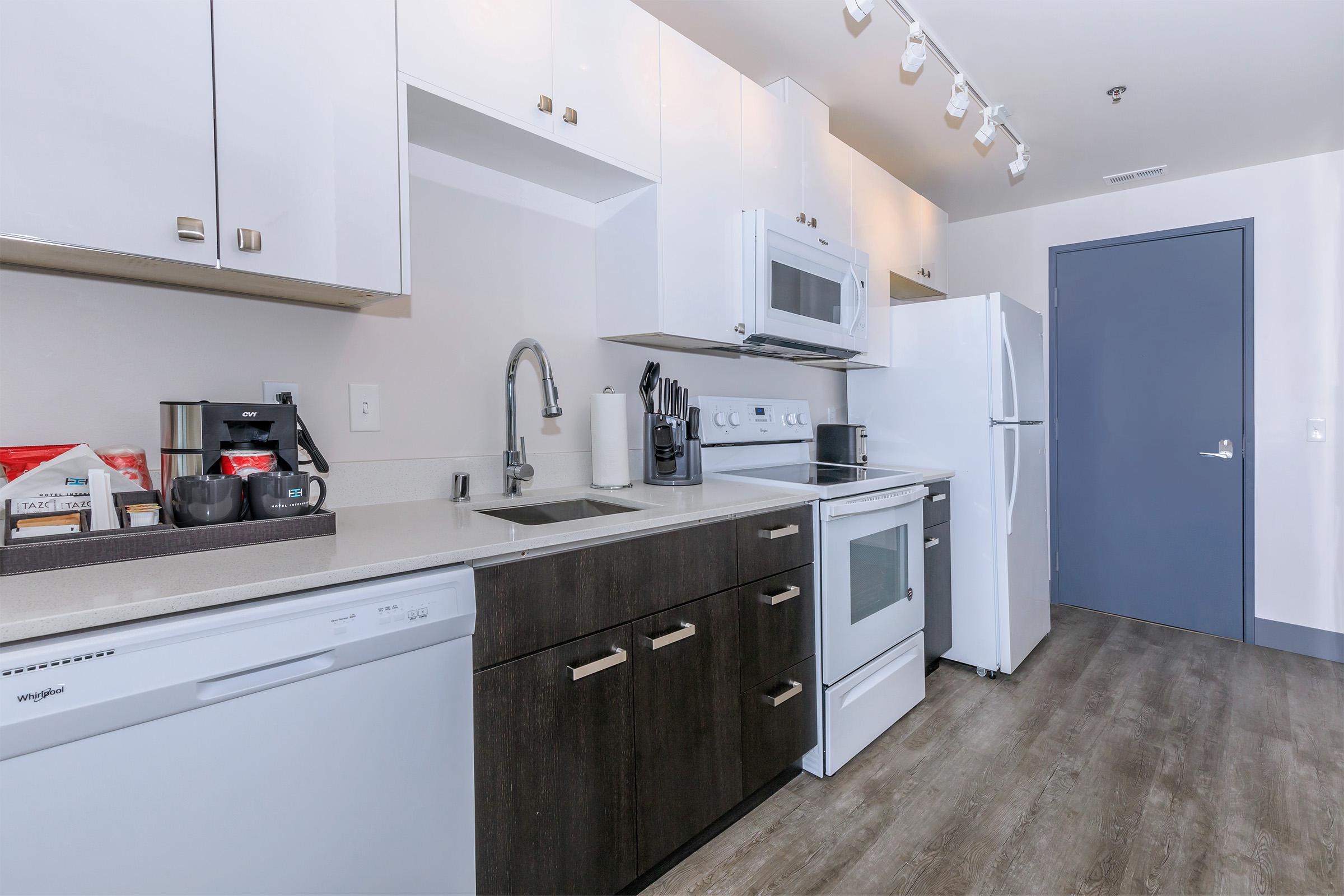 a kitchen with a sink and a refrigerator