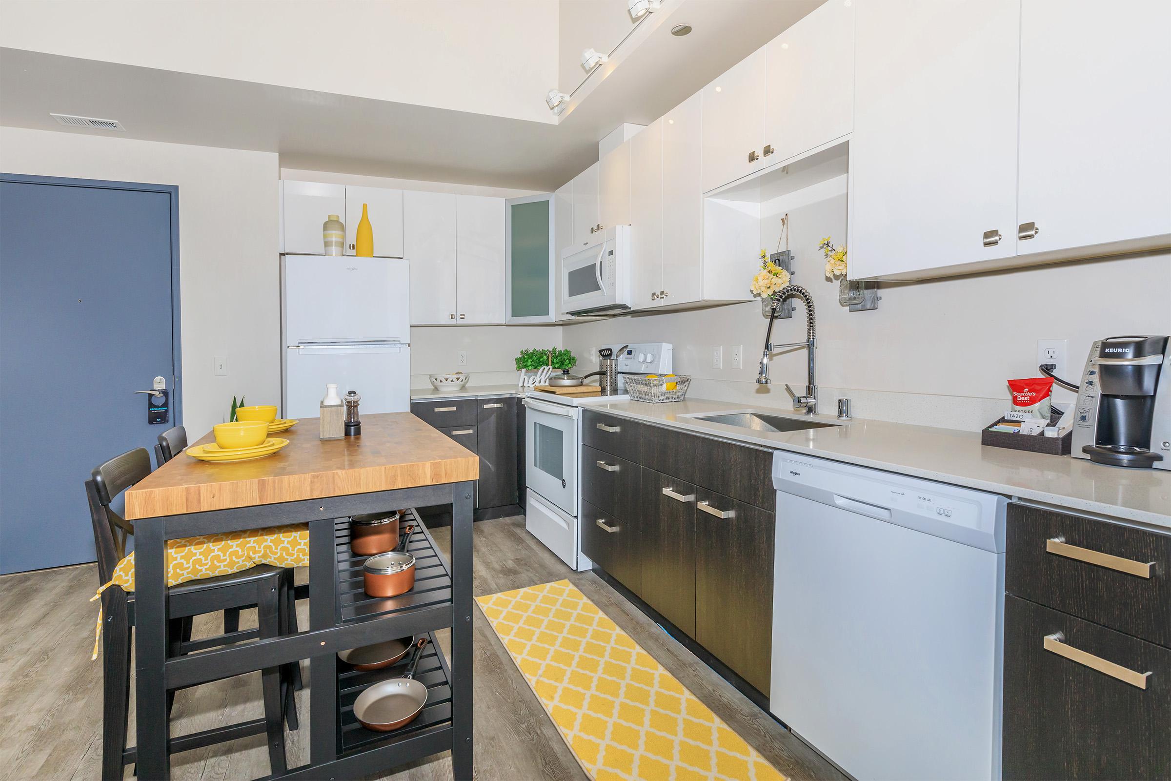 a kitchen with a table in a room