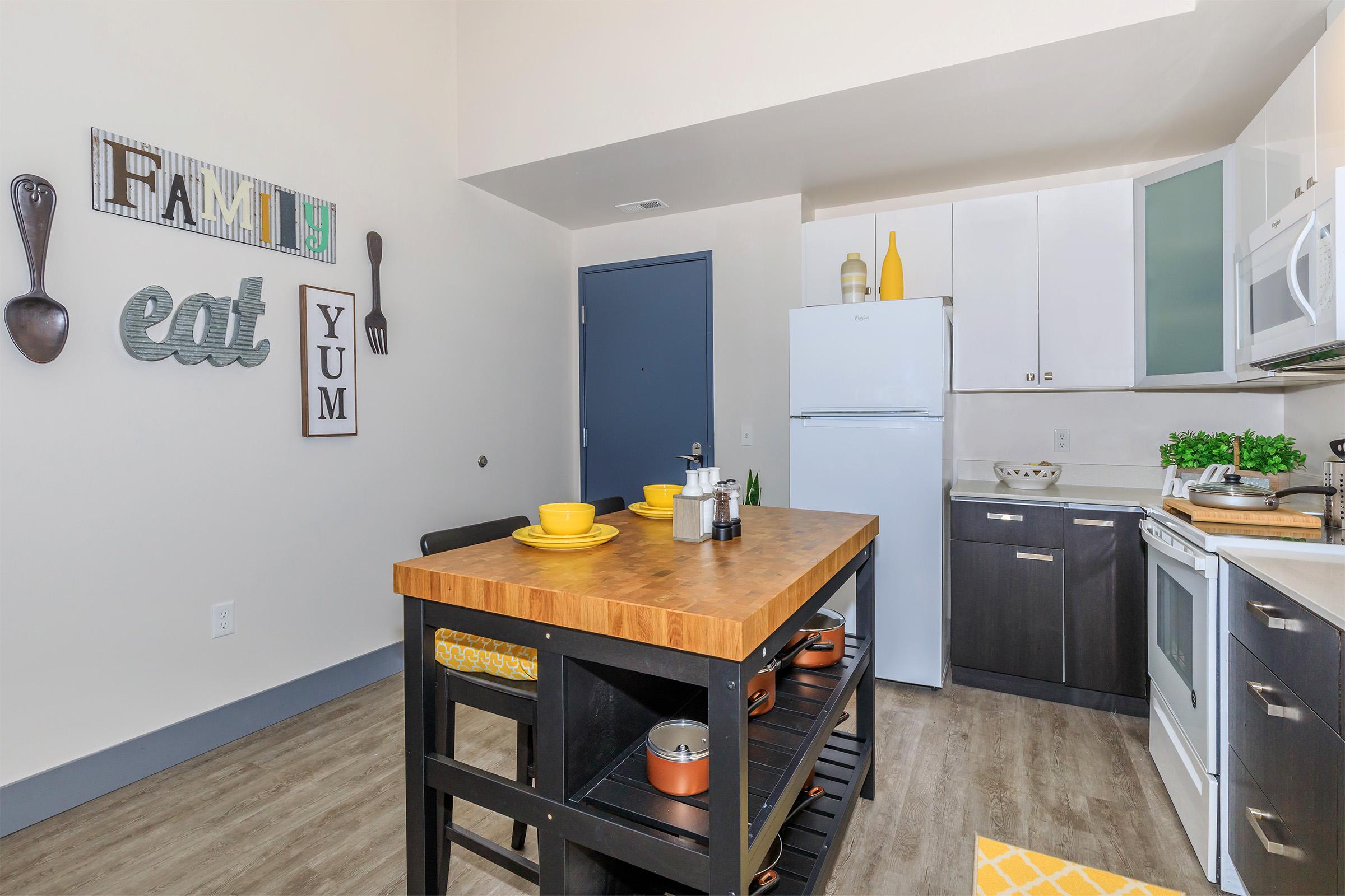 a kitchen with a sink and a mirror