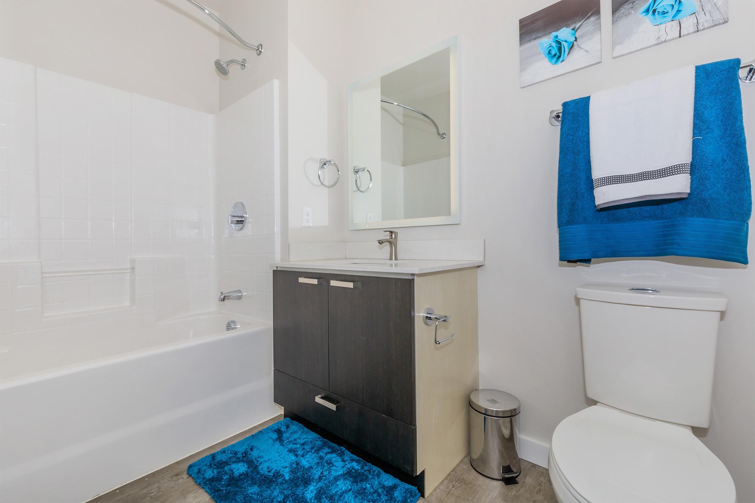 a room with a sink and a shower