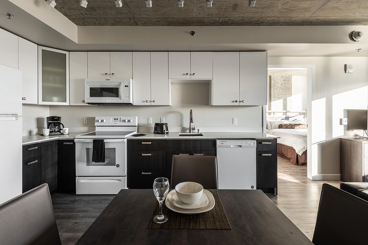 a modern kitchen with an island in the middle of a room