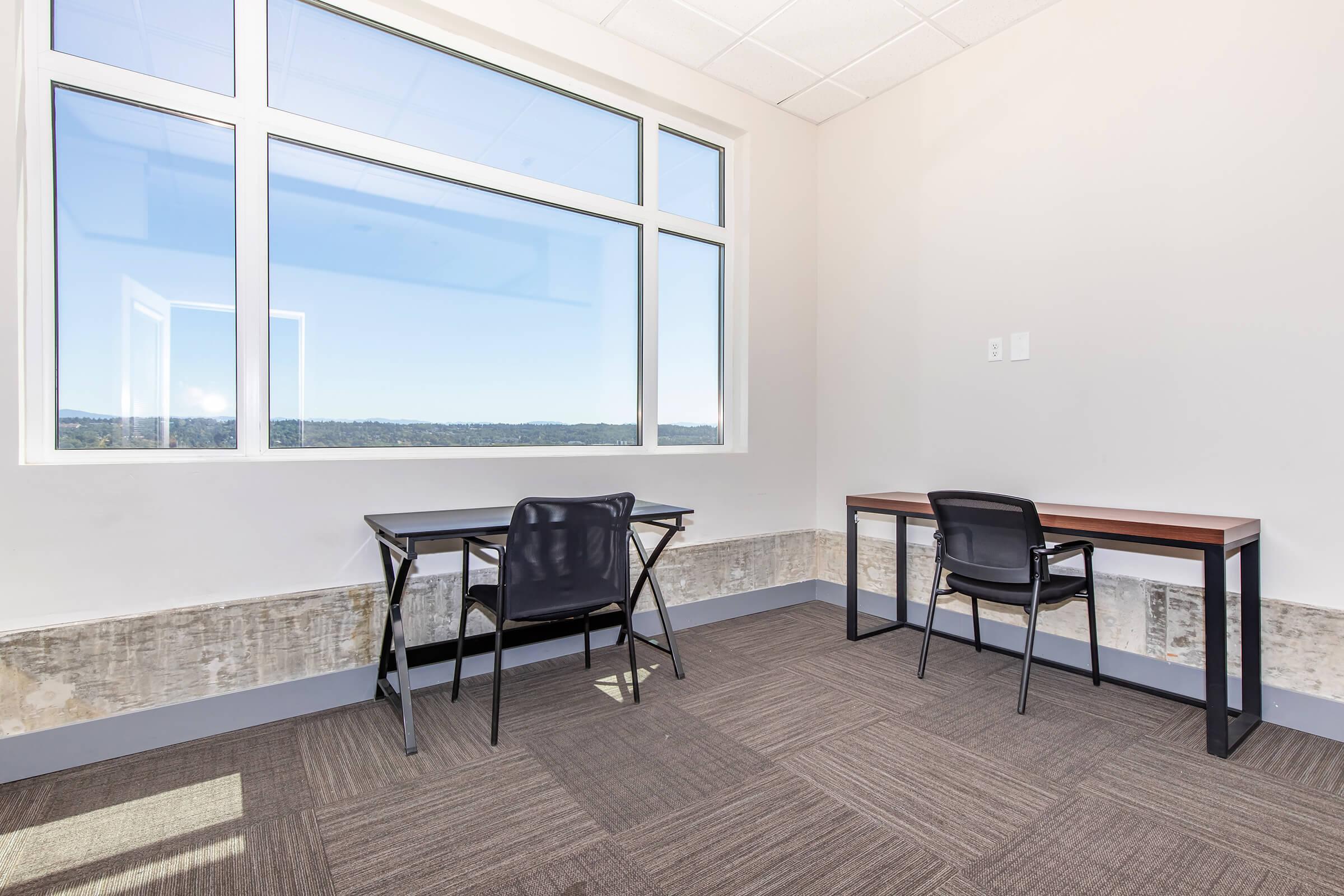 a room filled with furniture and a large window