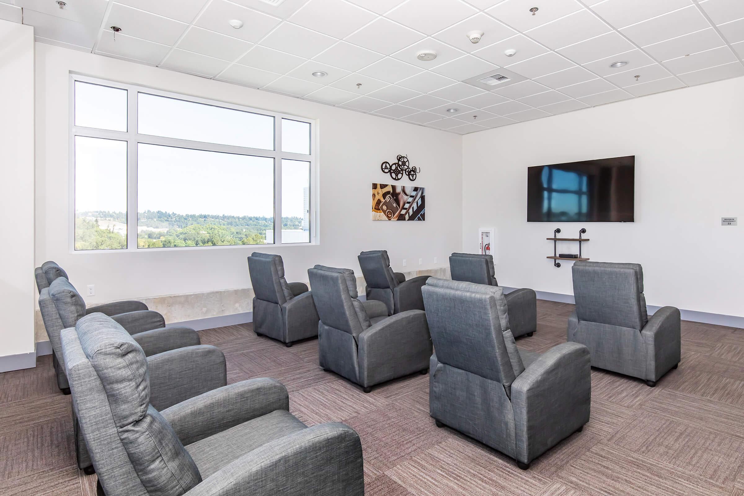 a living room filled with furniture and a flat screen tv