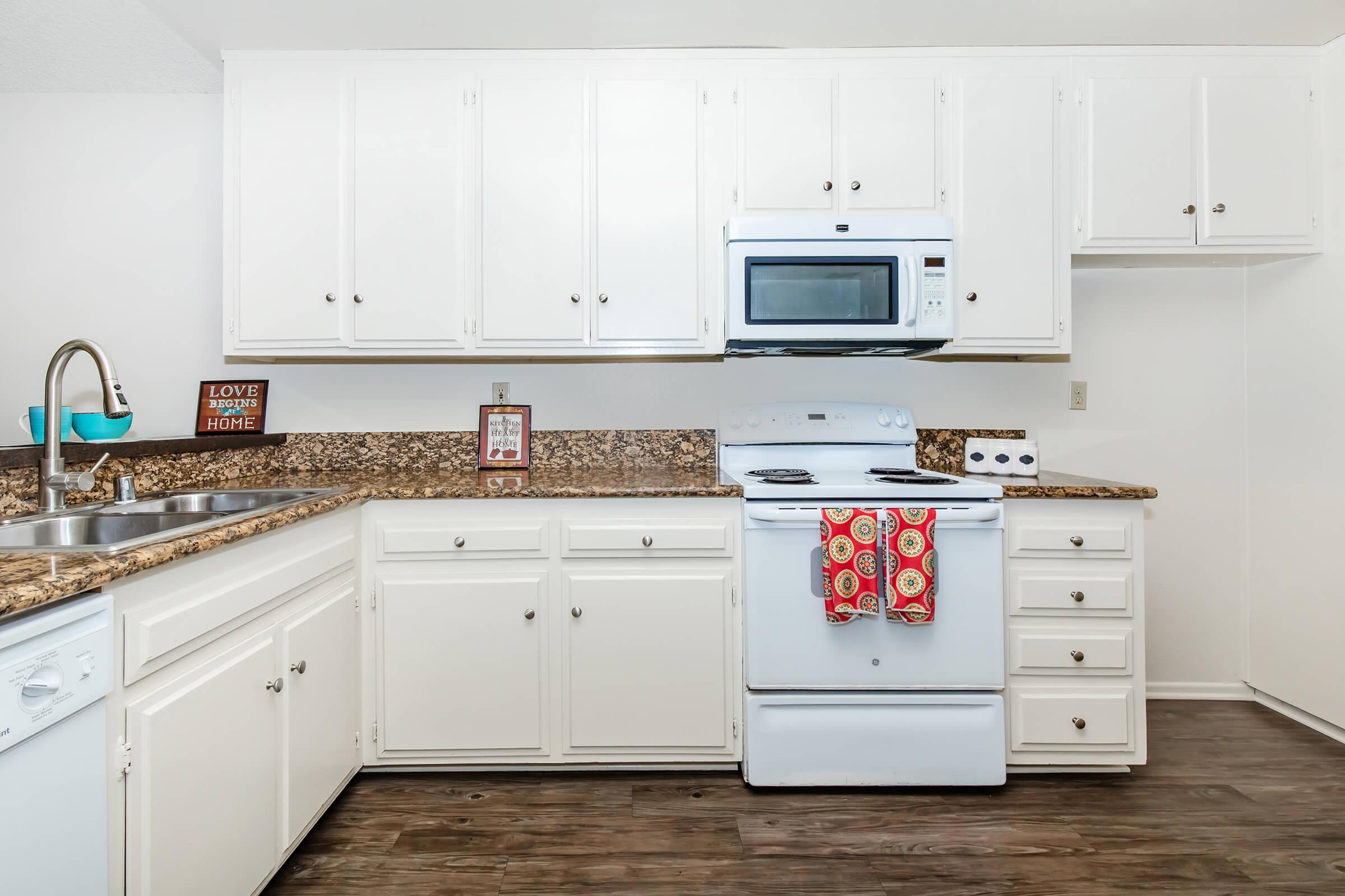 a kitchen with a stove and a refrigerator