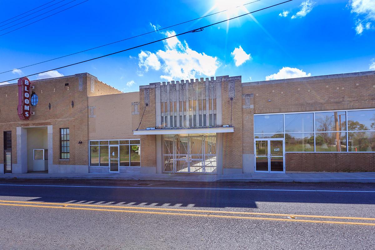 a building with a store on the side of a road