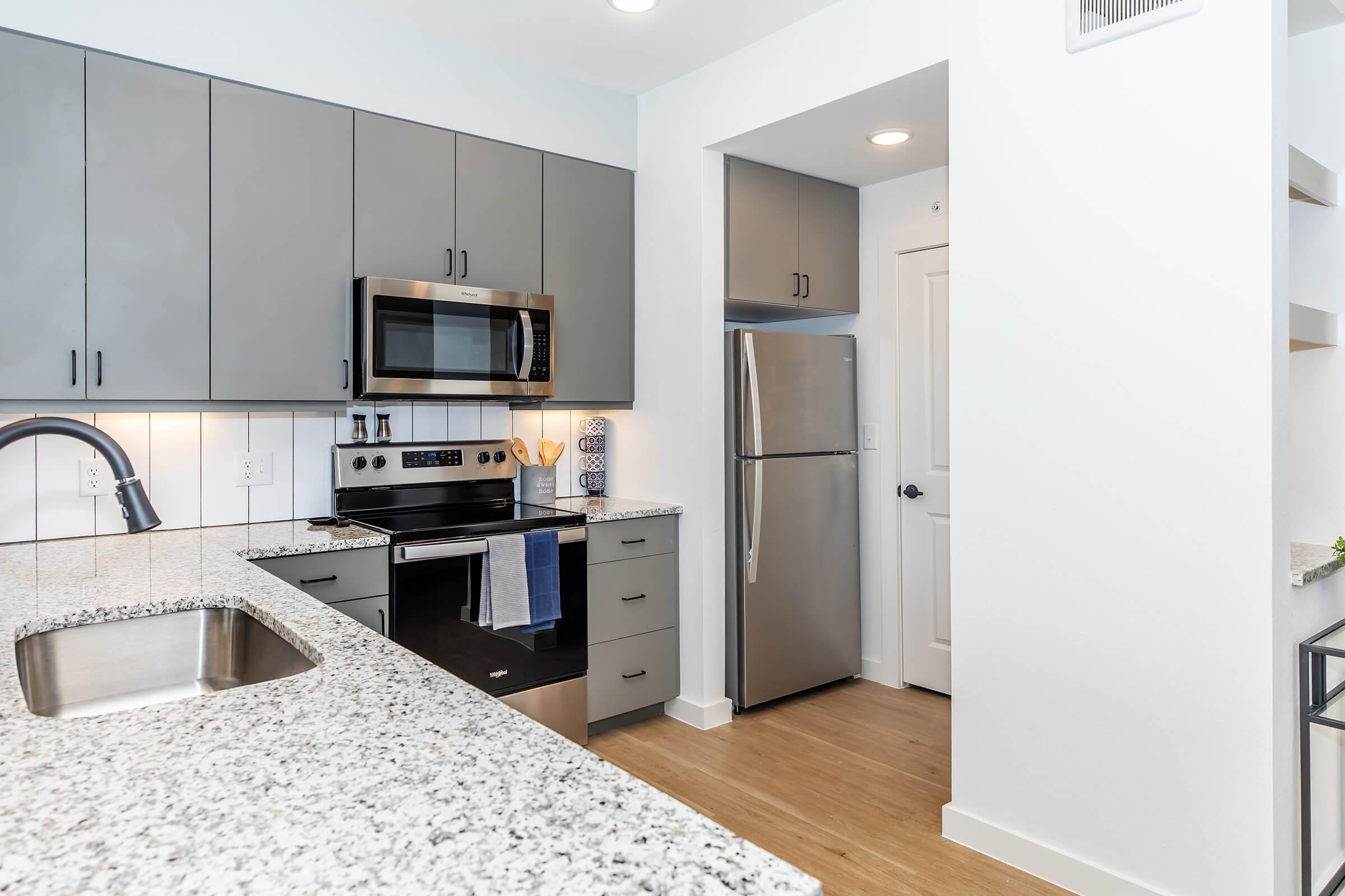 a modern kitchen with stainless steel appliances