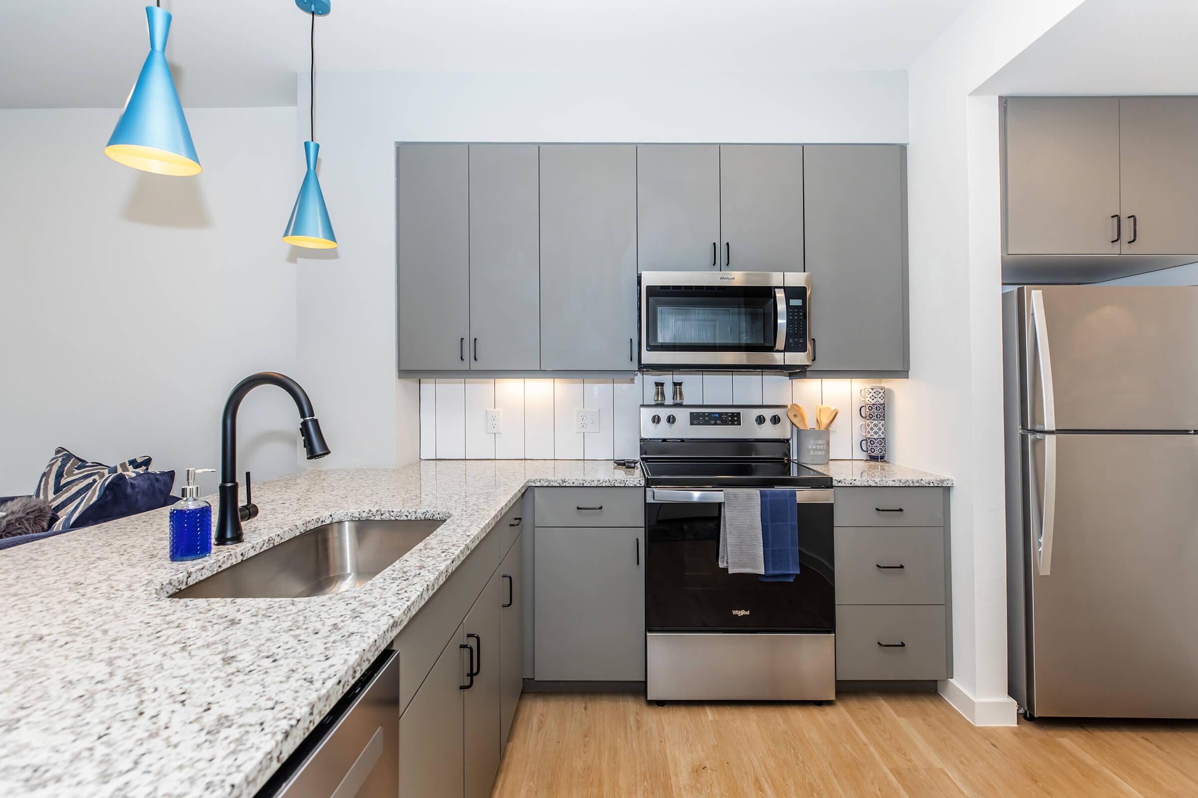 a kitchen with a stove and a refrigerator