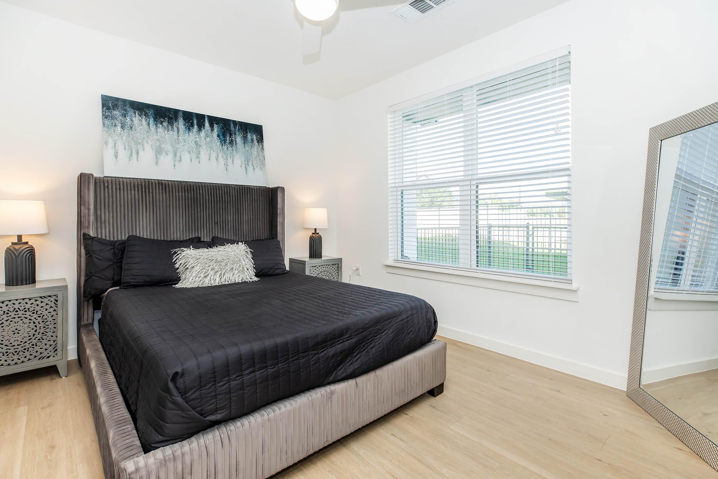 a bedroom with a large bed in a room