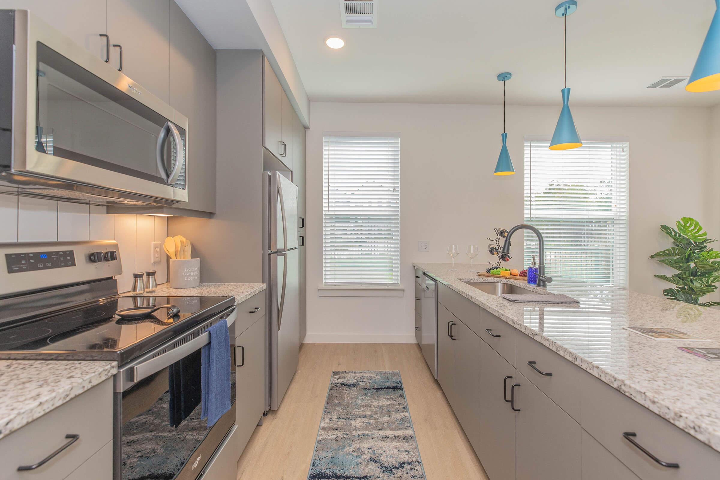 a stove top oven sitting inside of a kitchen