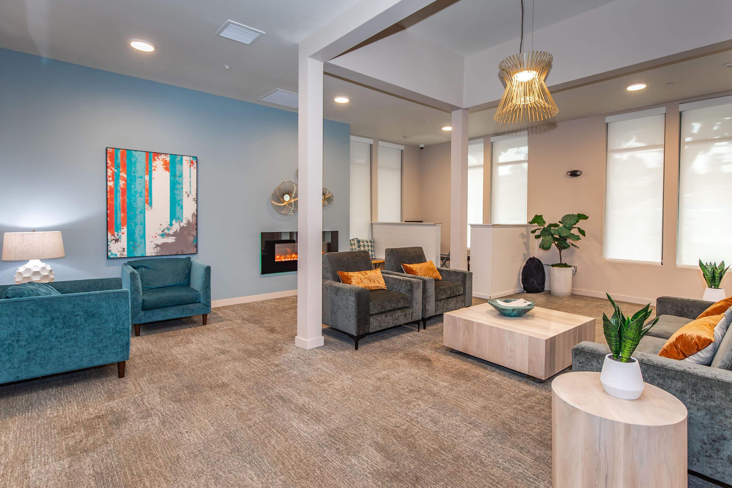 a living room filled with furniture and vase on a table