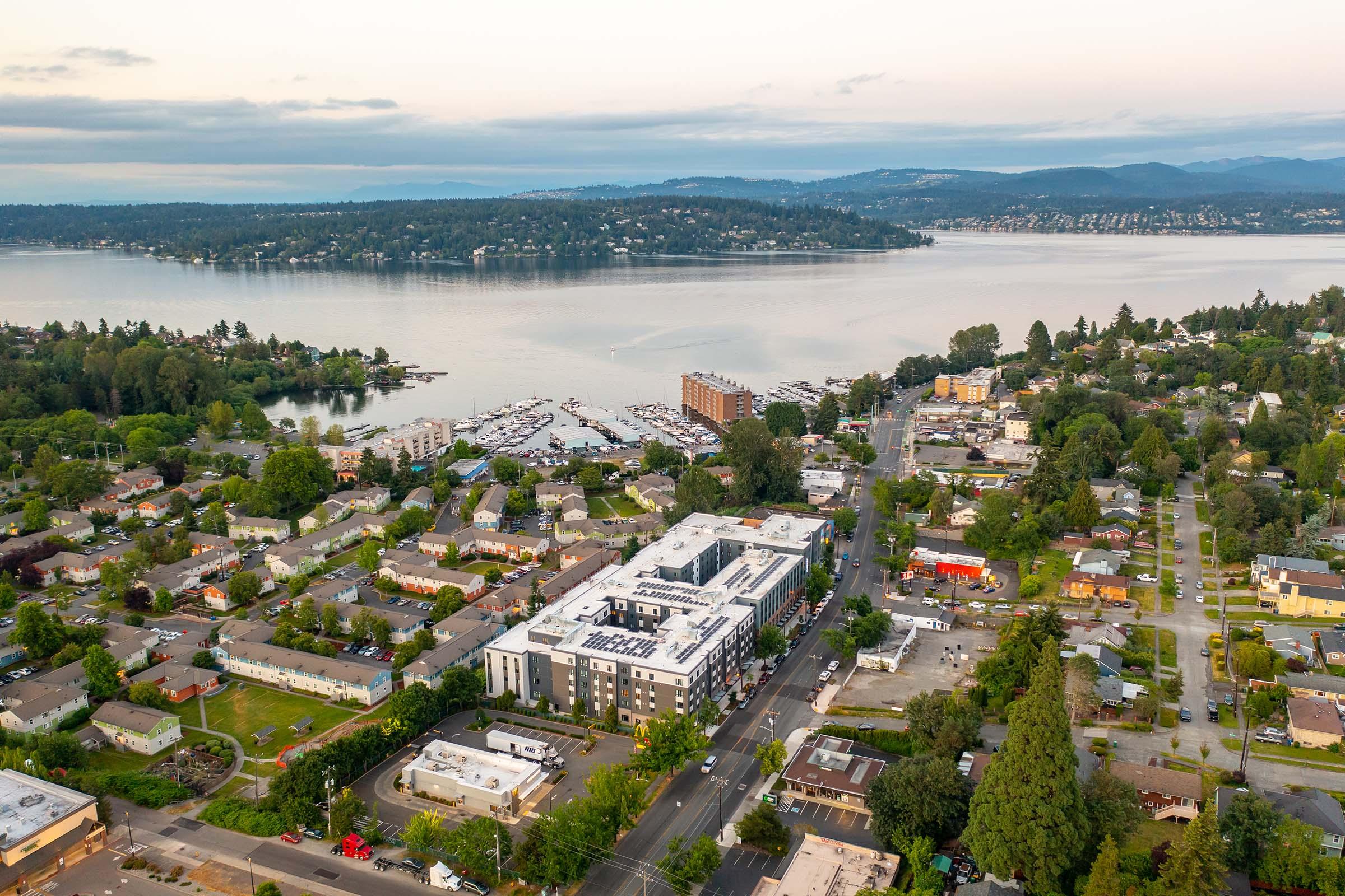 a large body of water with a city in the background